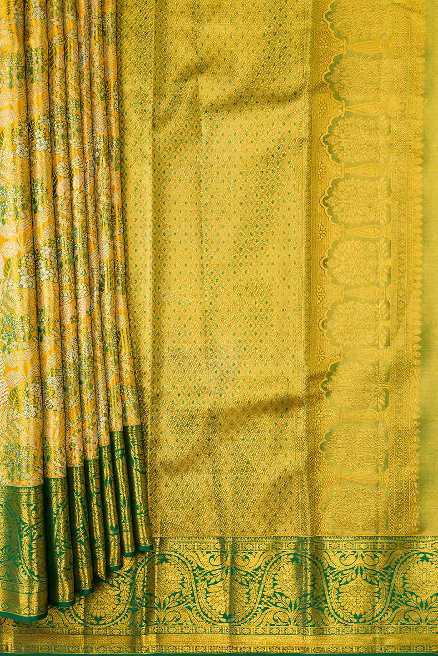 Pleats and pallu of Gold Dual Tone Kanchipuram Tissue Silk Saree with Zari Brocade on the body and Zari Border. 