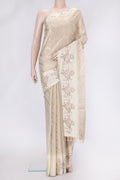 Beige Dual Tone Organza Silk Saree with Zari Brocade on the body and Embroidery Border.  displayed on a mannequin