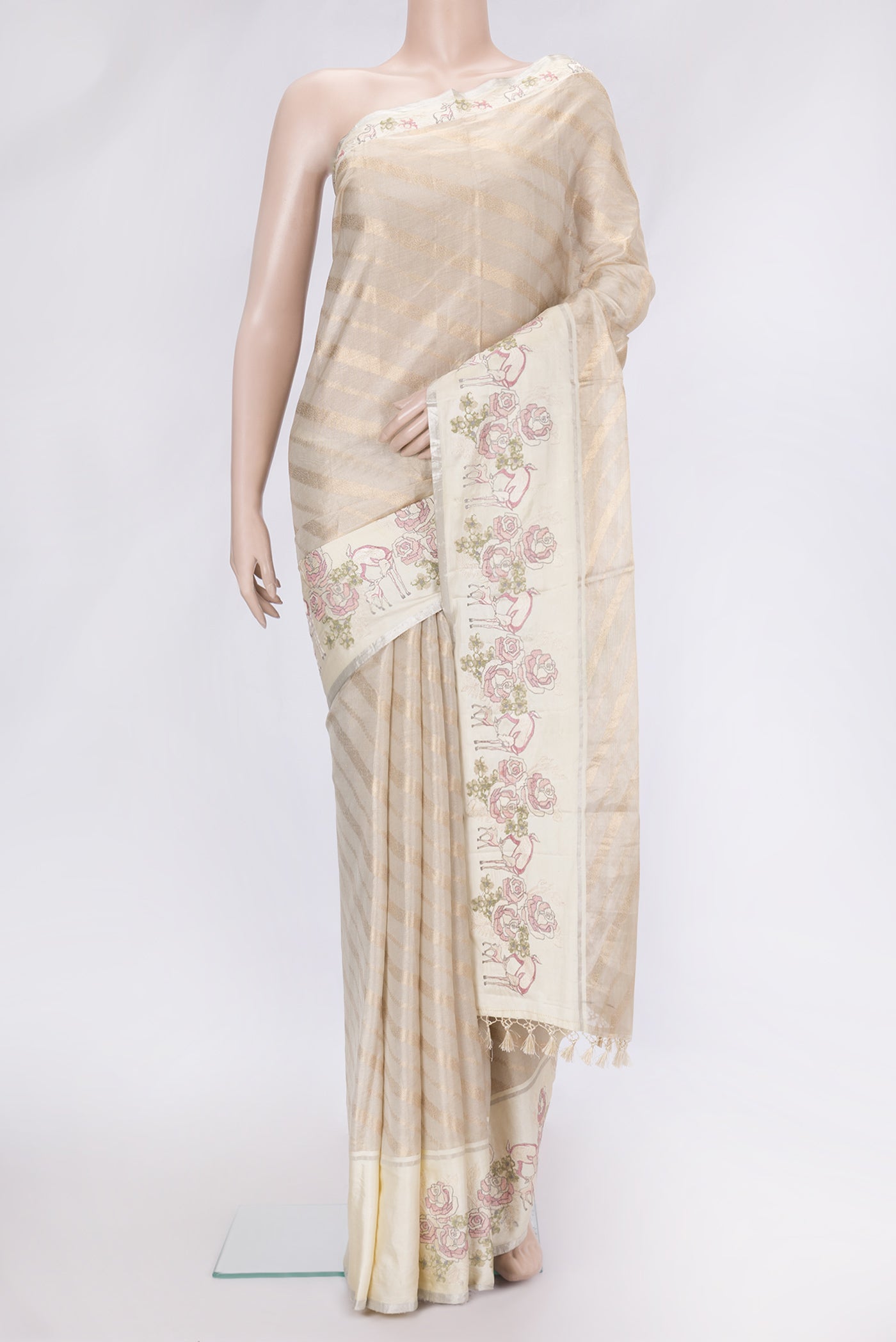 Beige Dual Tone Organza Silk Saree with Zari Brocade on the body and Embroidery Border.  displayed on a mannequin