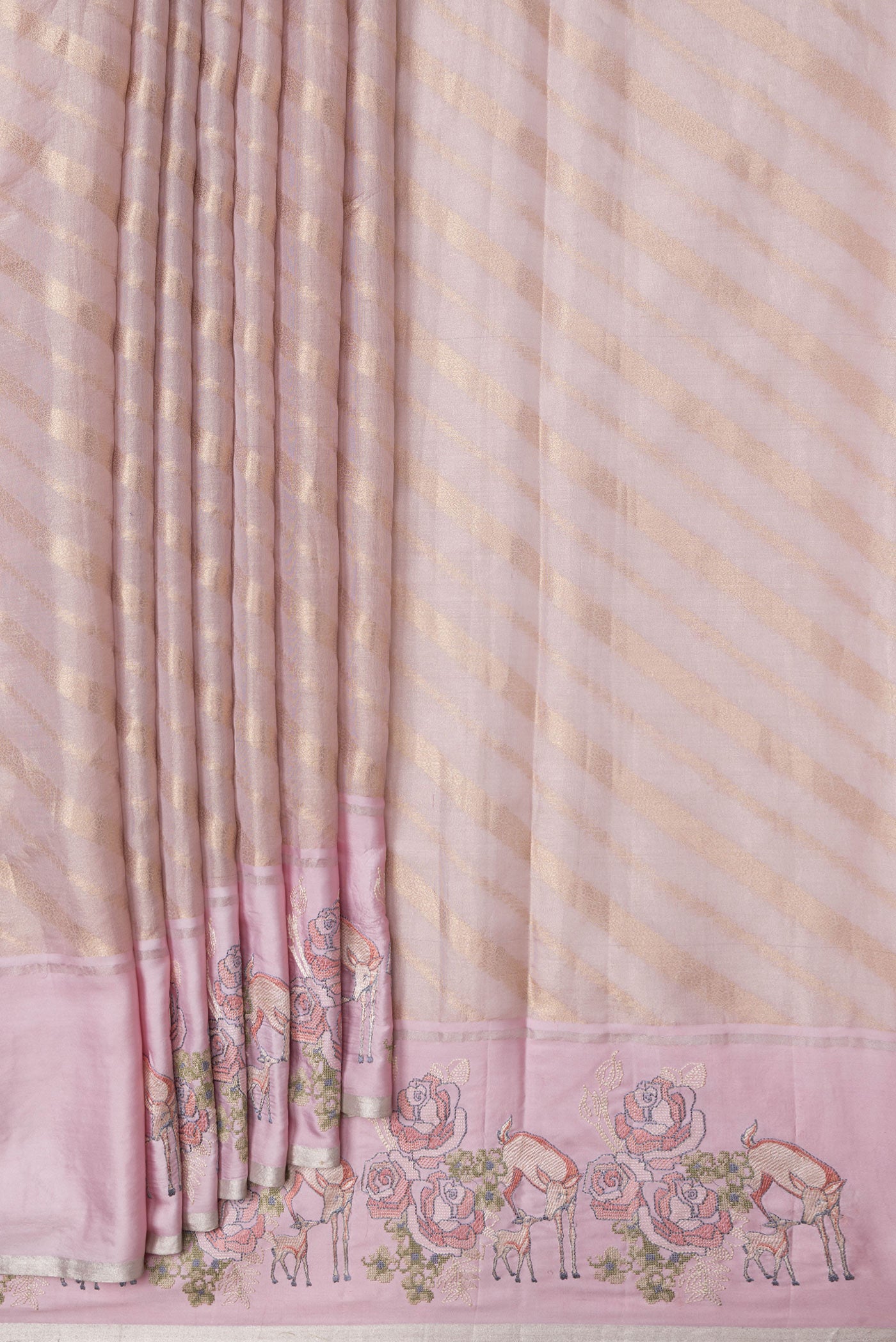 Pleats and pallu of Rose Gold Dual Tone Organza Silk Saree with Zari Brocade on the body and Embroidery Border. 