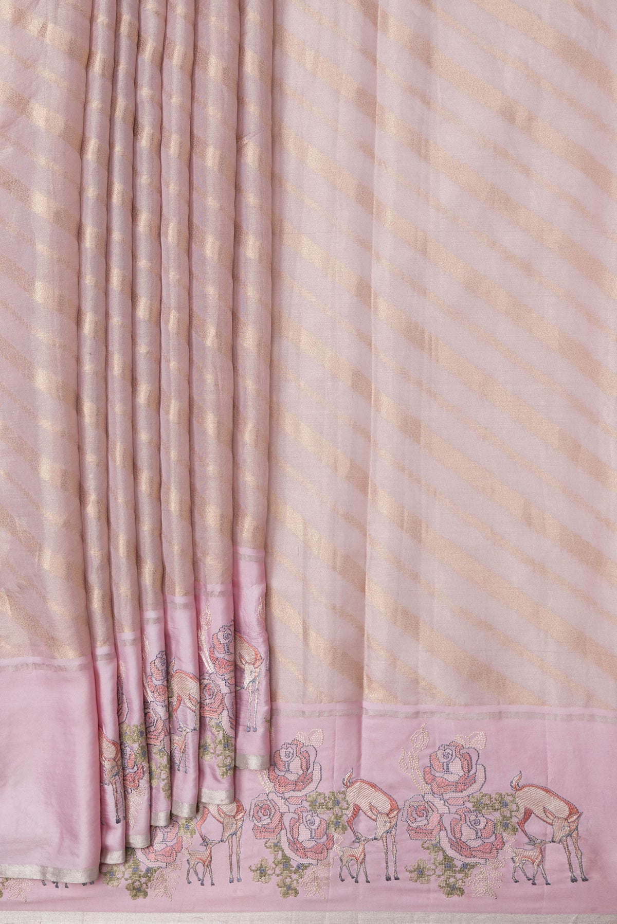 Pleats and pallu of Rose Gold Dual Tone Organza Silk Saree with Zari Brocade on the body and Embroidery Border. 