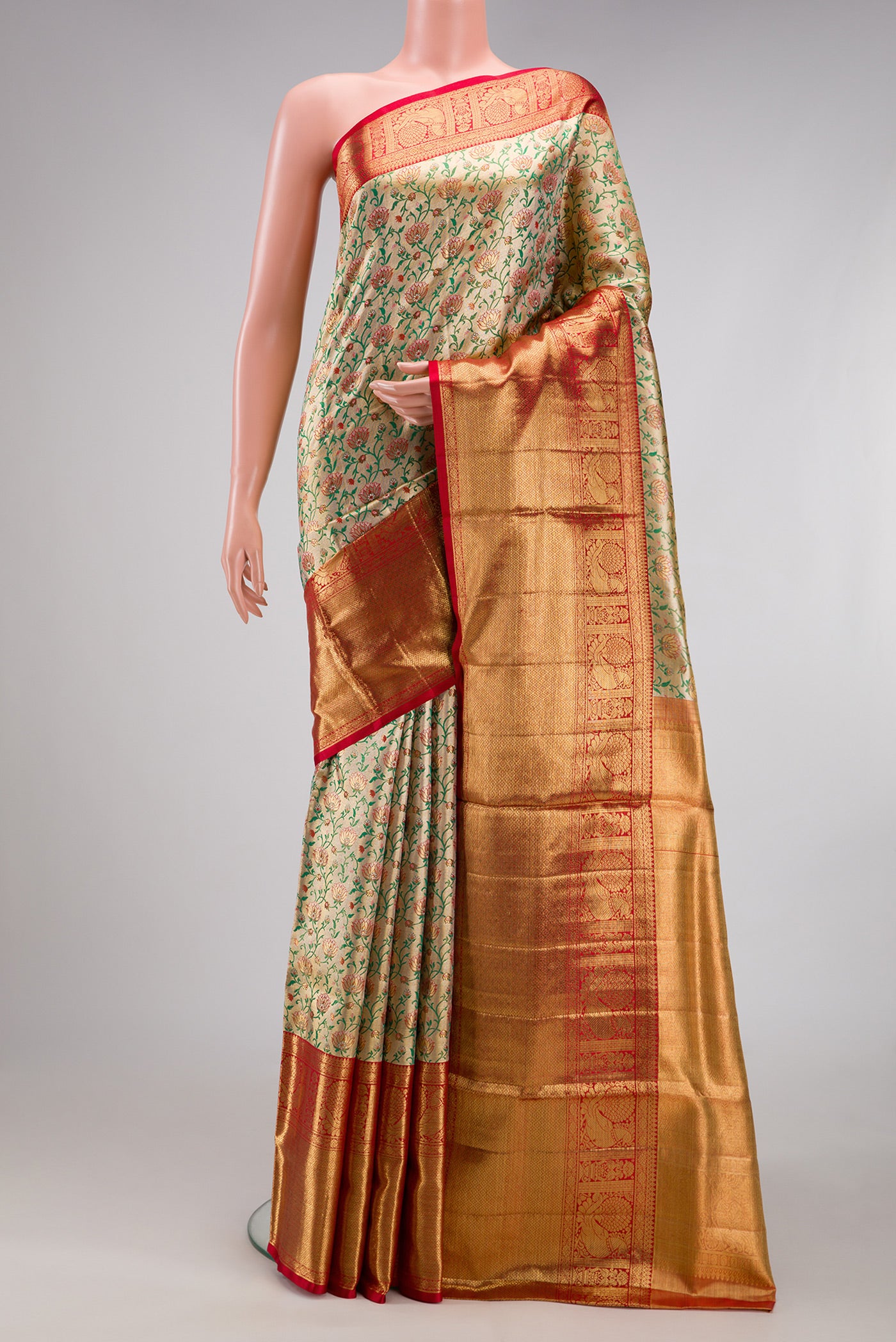 Gold Dual Tone Kanjivaram Tissue Silk Saree with Zari Brocade on the body and Zari Border.  displayed on a mannequin