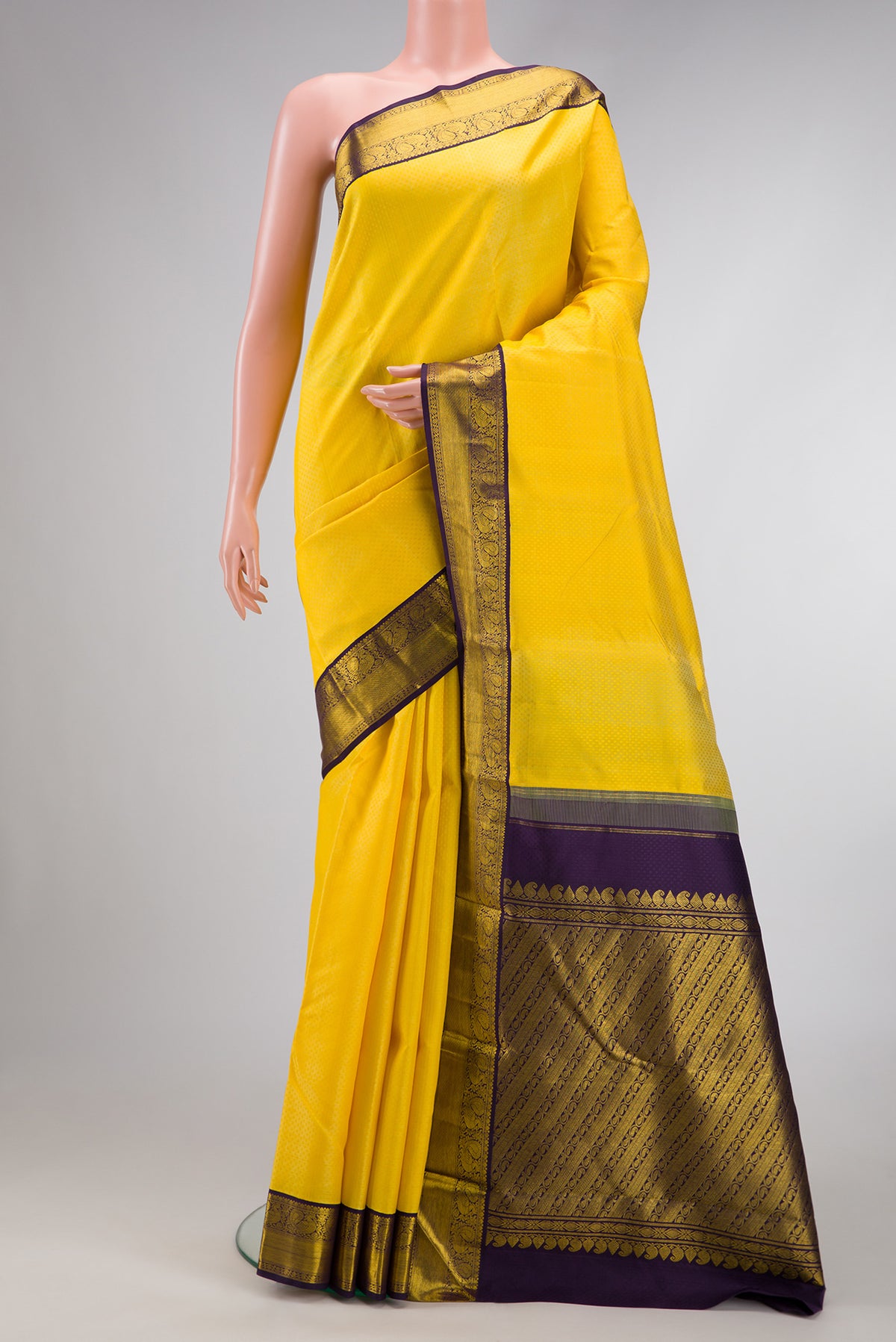 Yellow Dual Tone Kanjivaram Silk Saree with Jacquard design on the body and Zari Border.  displayed on a mannequin
