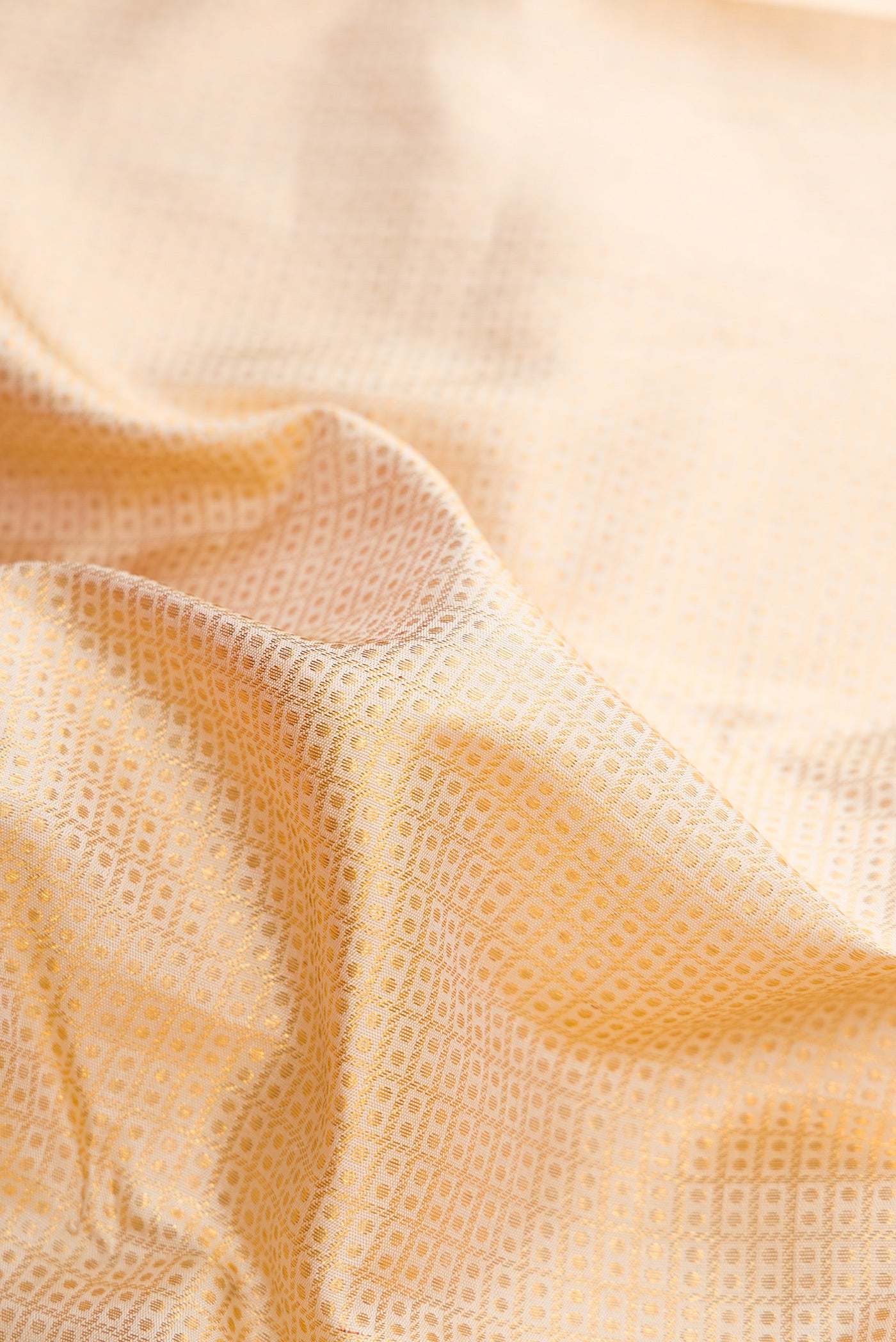 Close up of Sandal Dual Tone Kanchipuram Silk Saree with Zari Brocade on the body and Fancy Border.  displaying folds