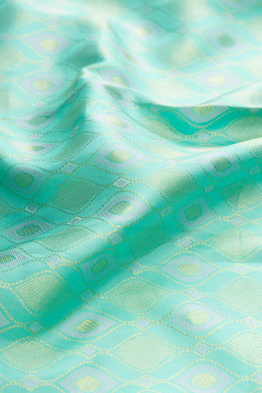 Close up of Sea Green Dual Tone Kanchipuram Silk Saree with Zari Brocade on the body and Zari Border displaying folds