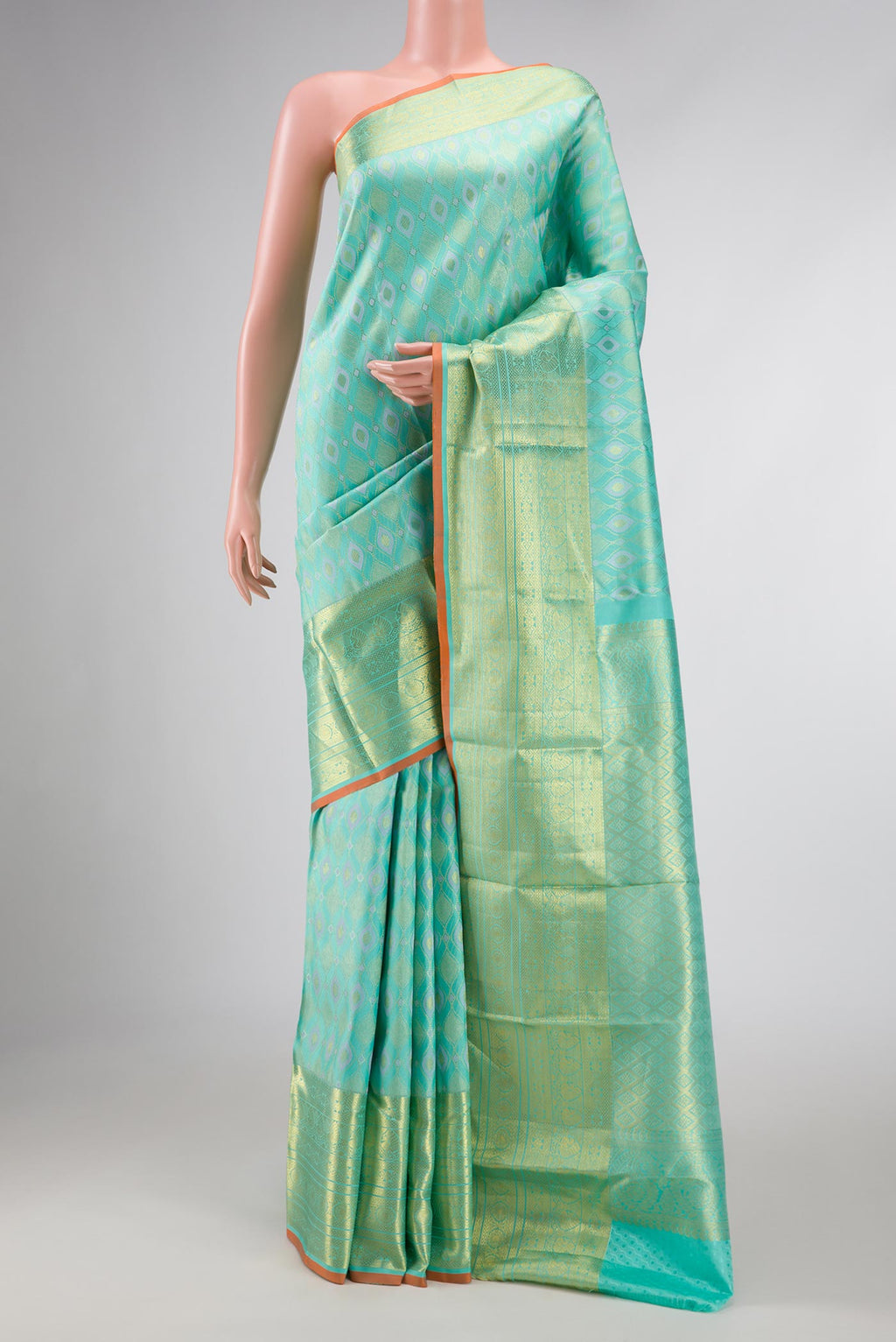 Sea Green Dual Tone Kanchipuram Silk Saree with Zari Brocade on the body and Zari Border displayed on a mannequin