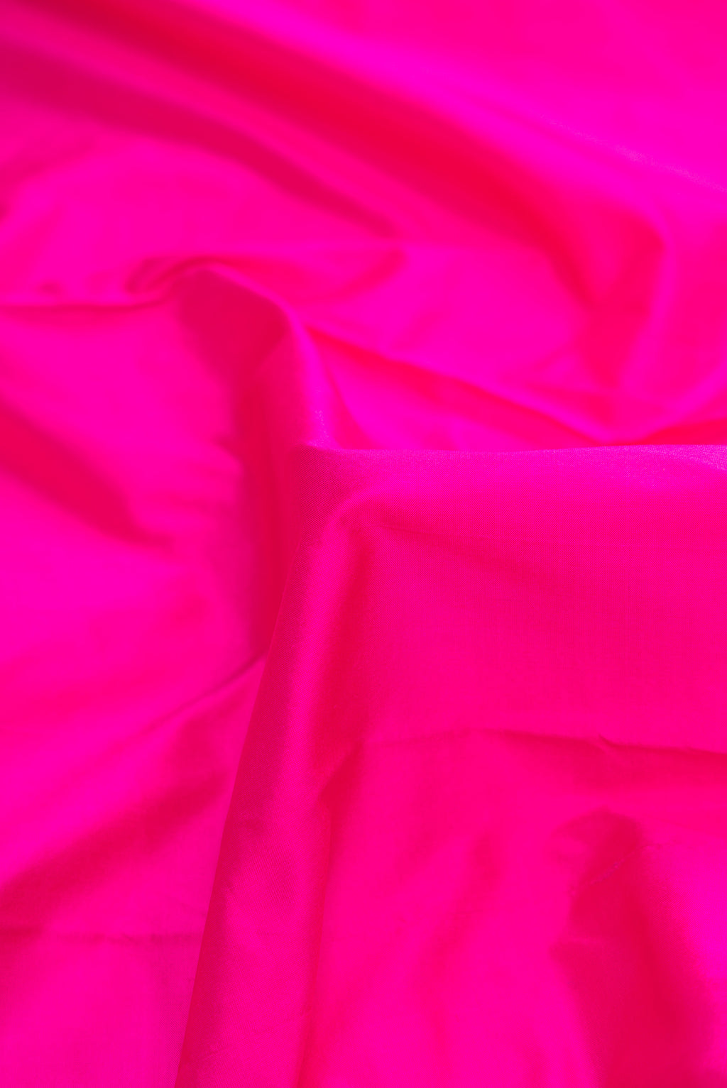 Close up of Pink Dual Tone Kanchipuram Silk Saree with Plain Body and Temple Border.  displaying folds