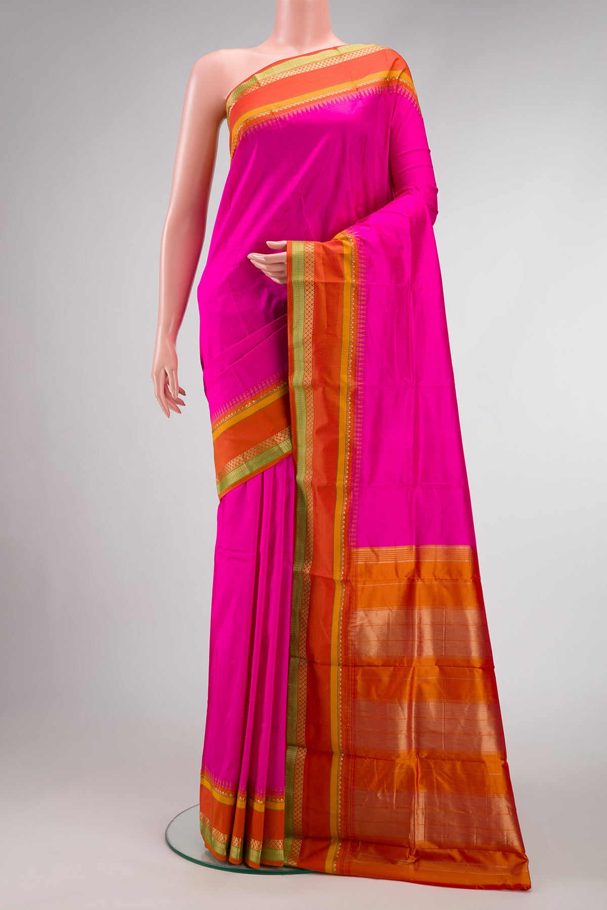 Pink Dual Tone Kanchipuram Silk Saree with Plain Body and Temple Border.  displayed on a mannequin
