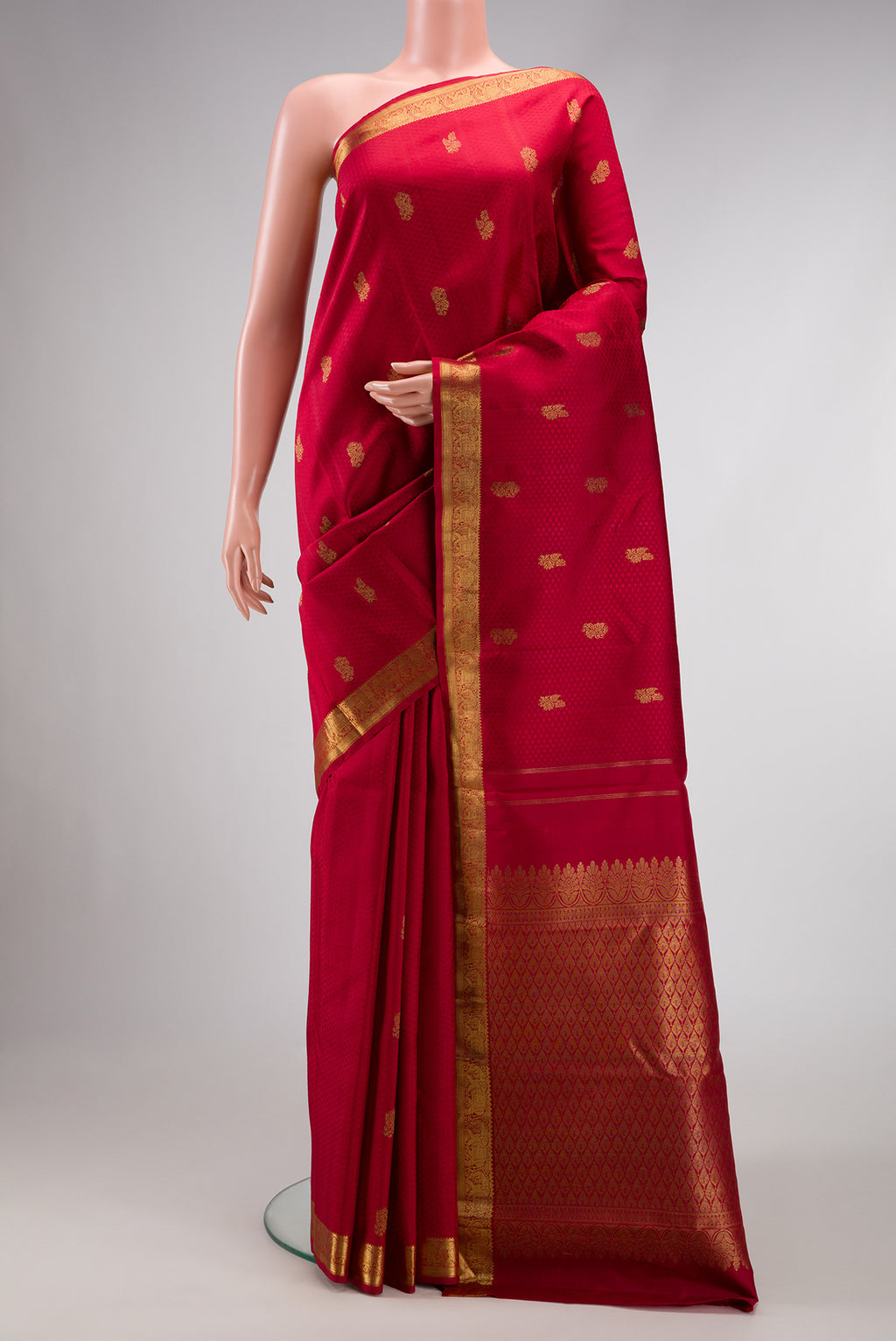 Pure Silk Pure Zari Red Dual Tone Kanjivaram Saree with Jacquard design on the body and Zari Border.  displayed on a mannequin