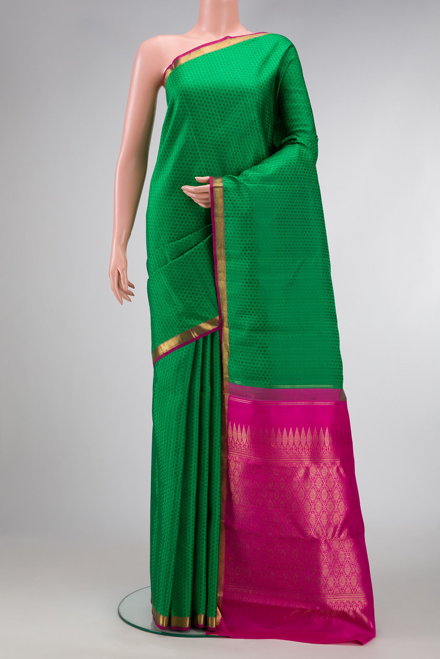 Green Dual Tone Kanchipuram Silk Saree with Jacquard design on the body and Zari Border.  displayed on a mannequin