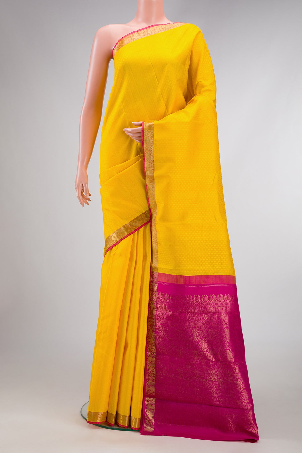 Yellow Dual Tone Kanjivaram Silk Saree with Jacquard design on the body and Zari Border.  displayed on a mannequin