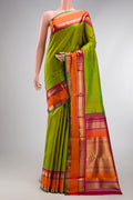 Pure Silk Pure Zari Parrot Green Kanjivaram Saree with Stripes on the body and Zari Border.  displayed on a mannequin