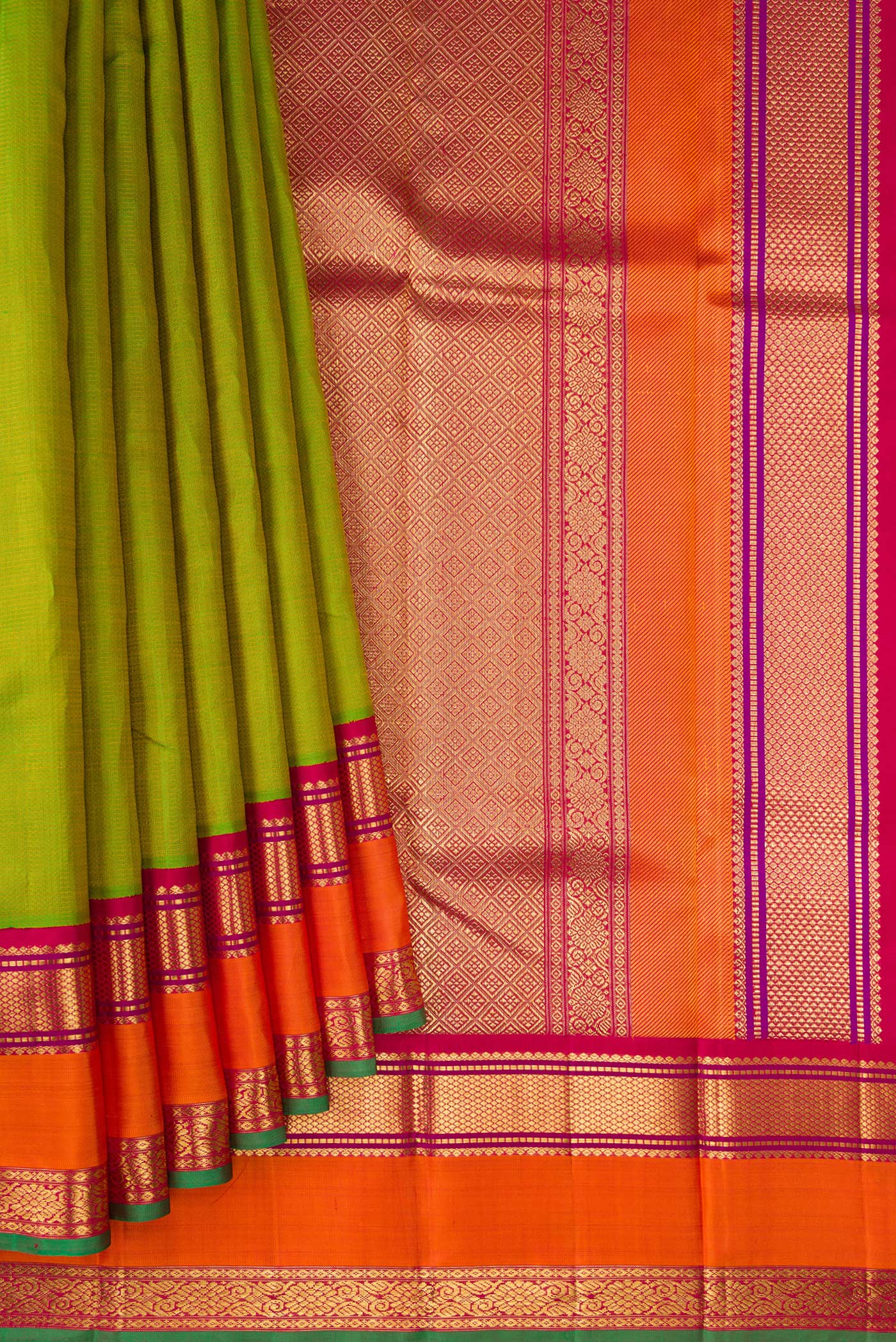 Pleats and pallu of Pure Silk Pure Zari Parrot Green Kanjivaram Saree with Stripes on the body and Zari Border. 