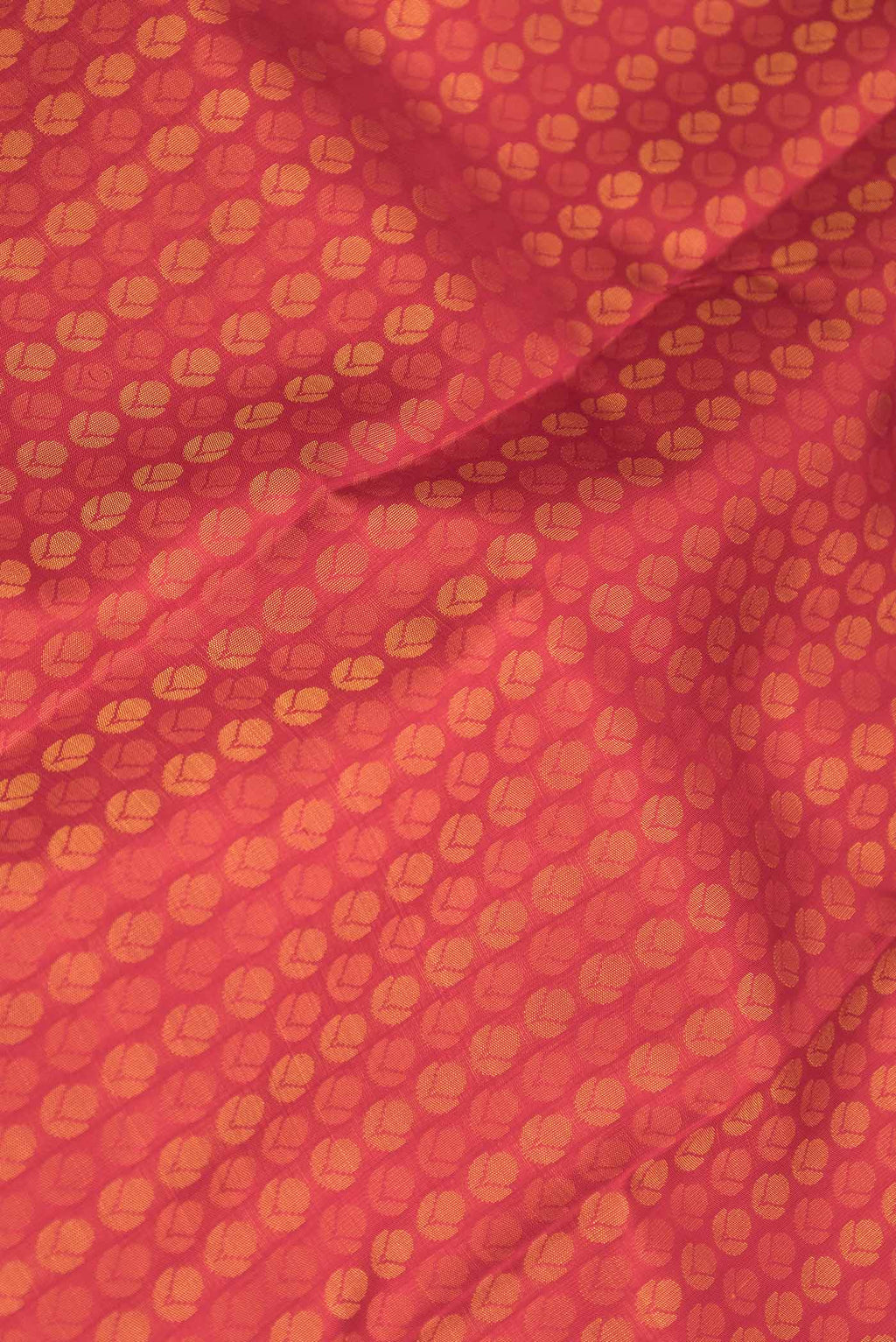 Close up of Pure Silk Pure Zari Red Dual Tone Kanchipuram Saree with Jacquard design on the body and Zari Border displaying folds