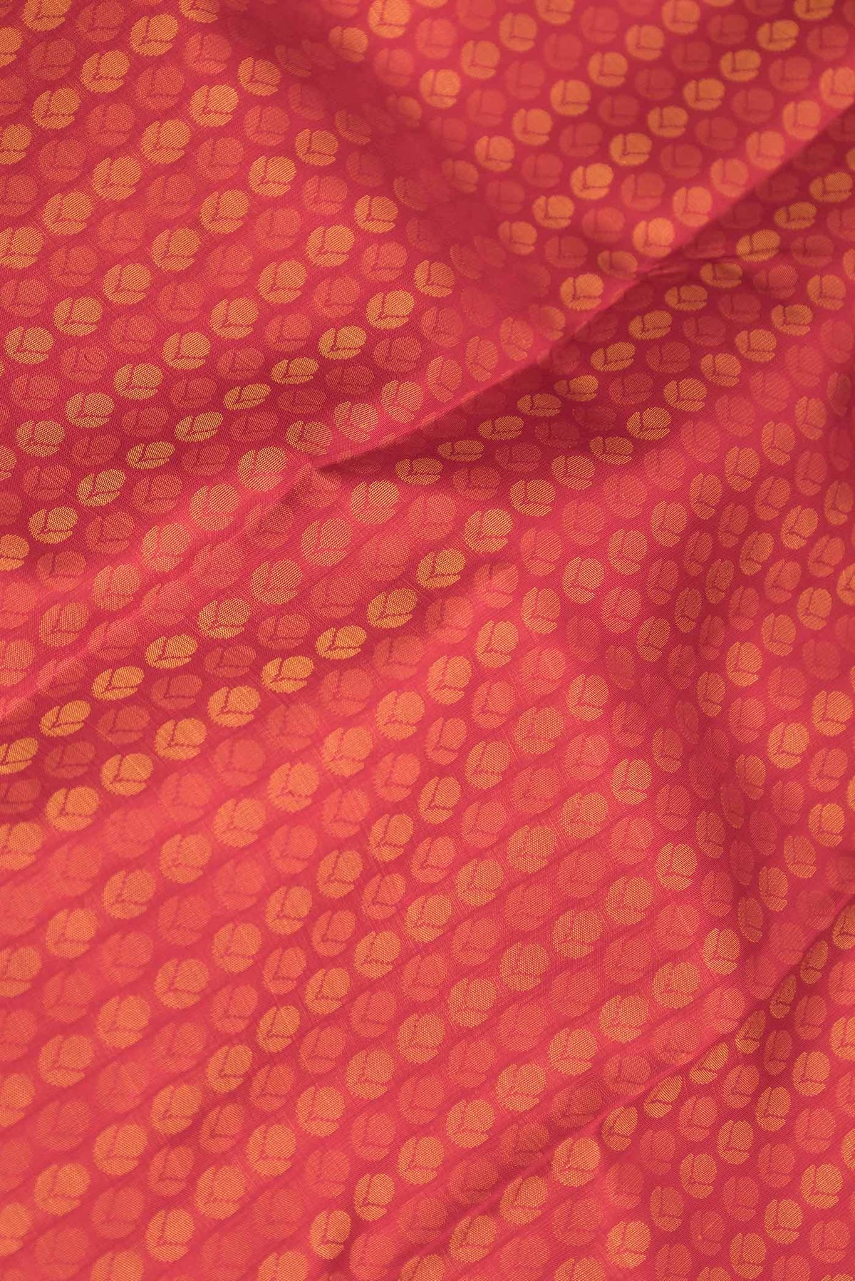 Close up of Pure Silk Pure Zari Red Dual Tone Kanchipuram Saree with Jacquard design on the body and Zari Border displaying folds