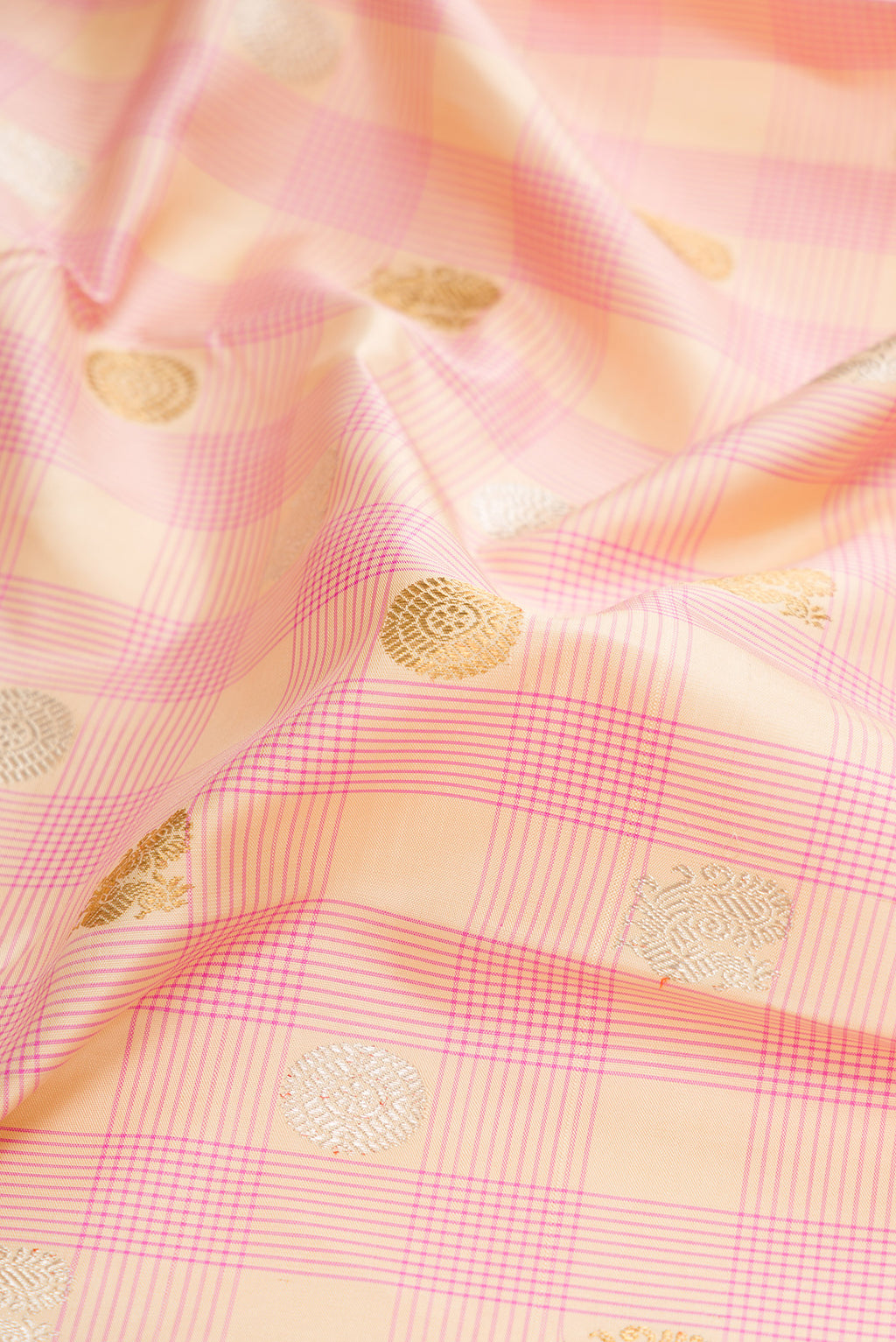 Close up of Pure Silk Pure Zari Sandal Dual Tone Kanchipuram Saree with Checked design on the body and Zari Border.  displaying folds