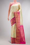 Pure Silk Pure Zari Pista Green Dual Tone Kanjivaram Saree with Zari Brocade on the body and Zari Border.  displayed on a mannequin