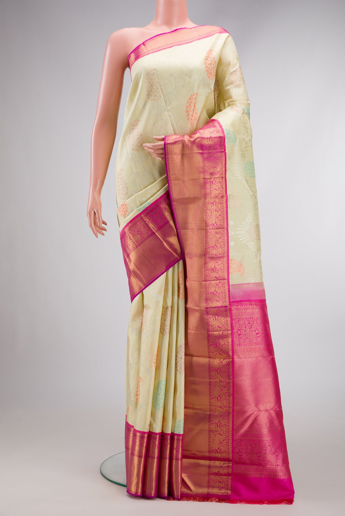 Pure Silk Pure Zari Pista Green Dual Tone Kanjivaram Saree with Zari Brocade on the body and Zari Border.  displayed on a mannequin