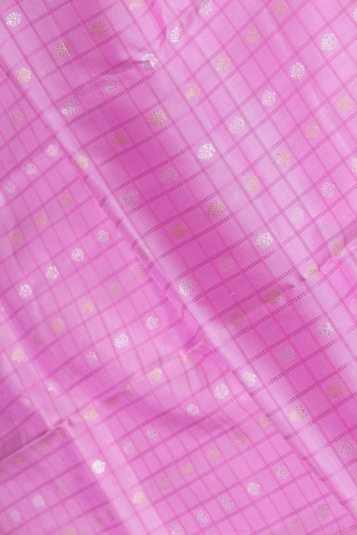 Close up of Pure Silk Pure Zari Pink Dual Tone Kanchipuram Saree Checked design on the body and Zari Border displaying folds
