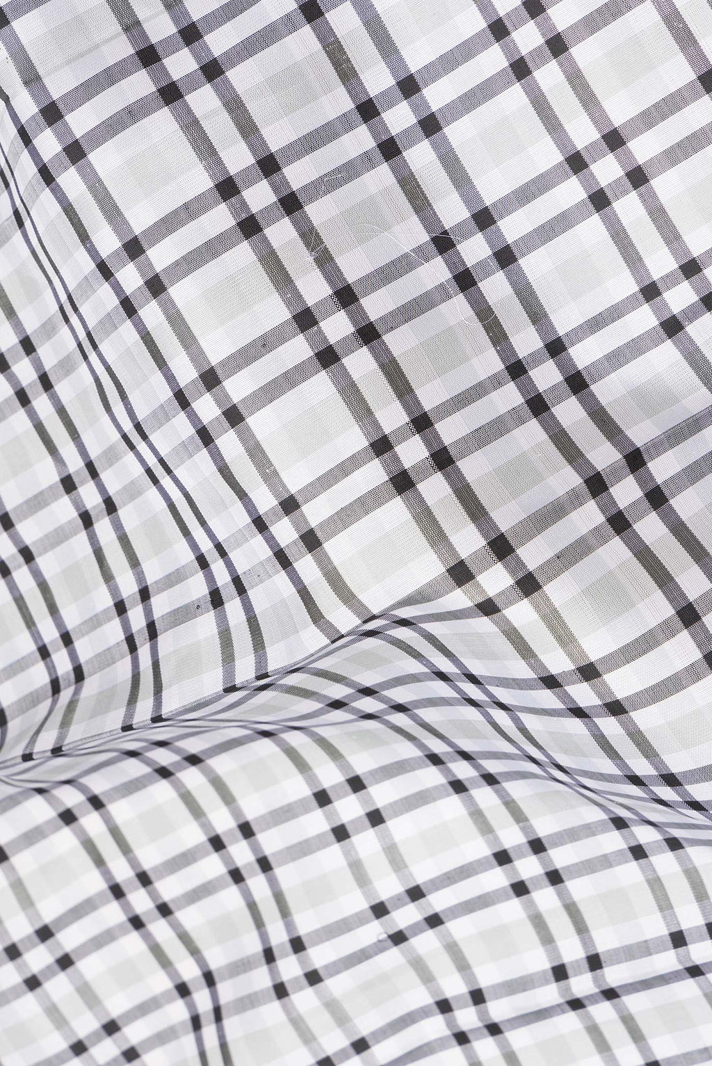 Close up of Pure Silk Pure Zari Off White Kanchipuram Saree with Checked design on the body and Zari Border.  displaying folds