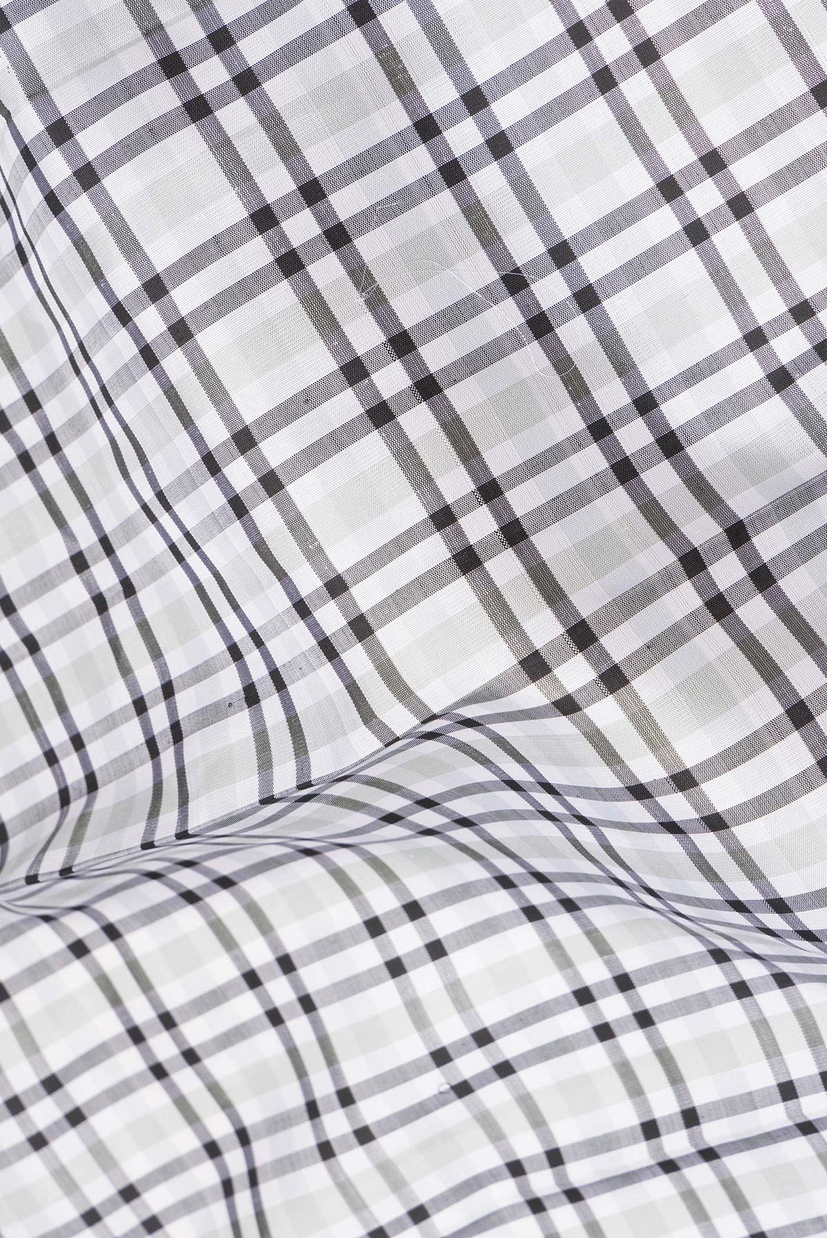 Close up of Pure Silk Pure Zari Off White Kanchipuram Saree with Checked design on the body and Zari Border.  displaying folds