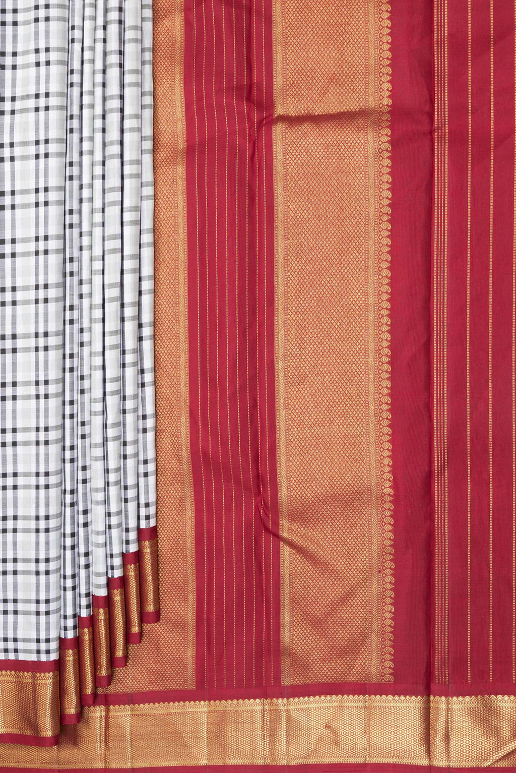 Pleats and pallu of Pure Silk Pure Zari Off White Kanchipuram Saree with Checked design on the body and Zari Border. 