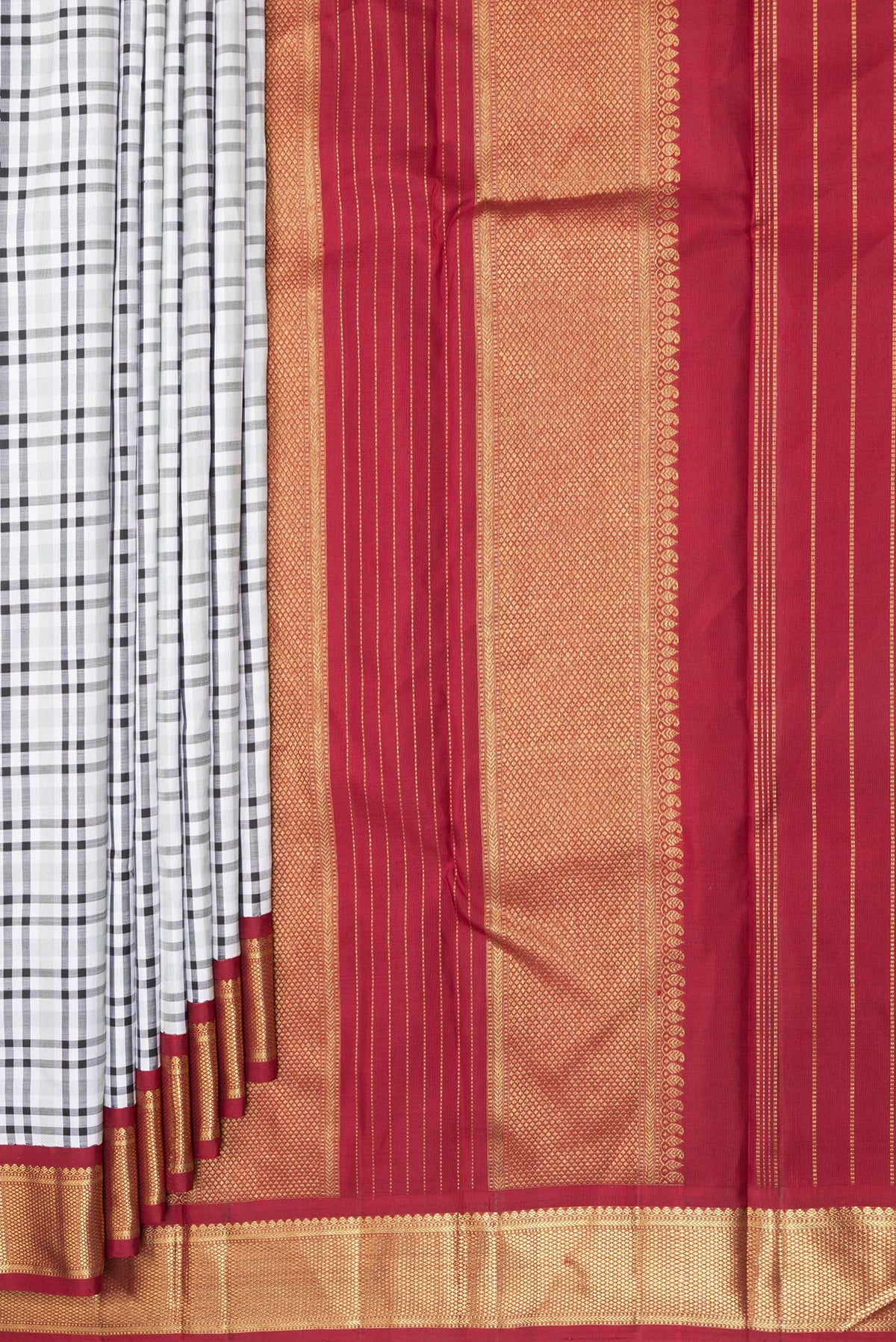 Pleats and pallu of Pure Silk Pure Zari Off White Kanchipuram Saree with Checked design on the body and Zari Border. 