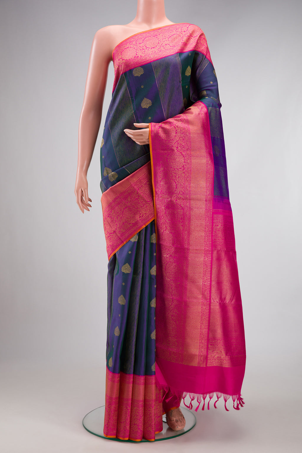 Pure Silk Pure Zari Peacock Blue Dual Tone Kanjivaram Saree with Zari Butta on the body and Fancy Border.  displayed on a mannequin