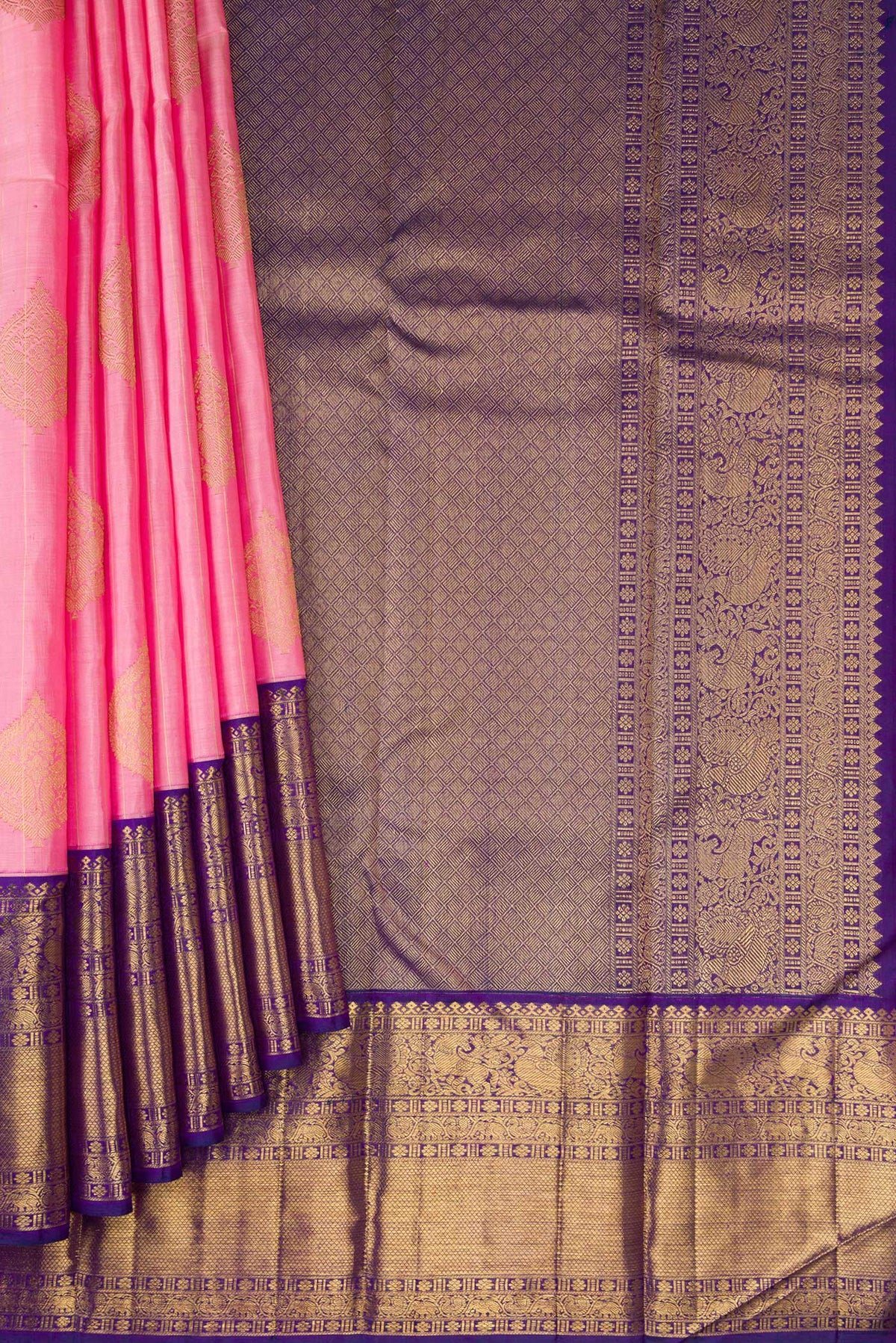 Pleats and pallu of Pure Silk Pure Zari Rose pink Kanjivaram Saree with Zari Butta on the body and Fancy Border. 
