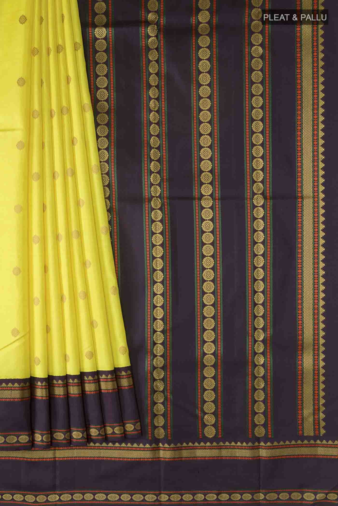 Pleats and pallu of Yellow Kanchipuram Silk Saree with Thread Butta on the body and Thread Border
