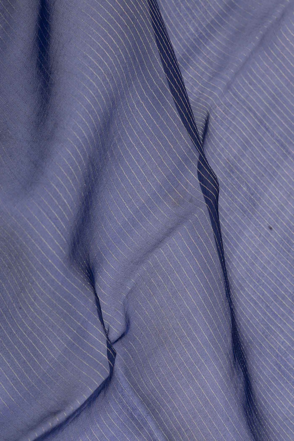 Close up of Navy Blue Dual Tone Organza Silk Saree with Stripes on the body and Embroidery Border displaying folds