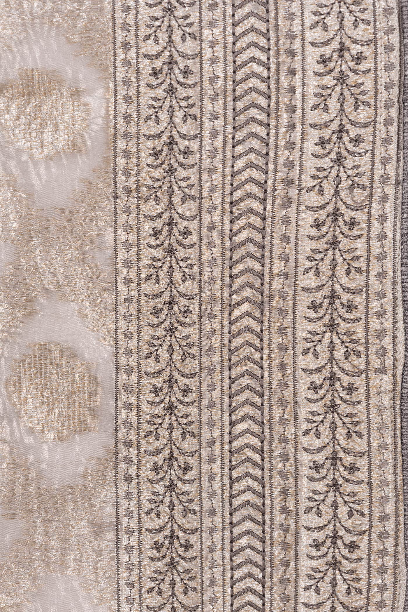 Border image of Silver Dual Tone Organza Silk Saree with Zari Brocade on the body and Embroidery Border. 