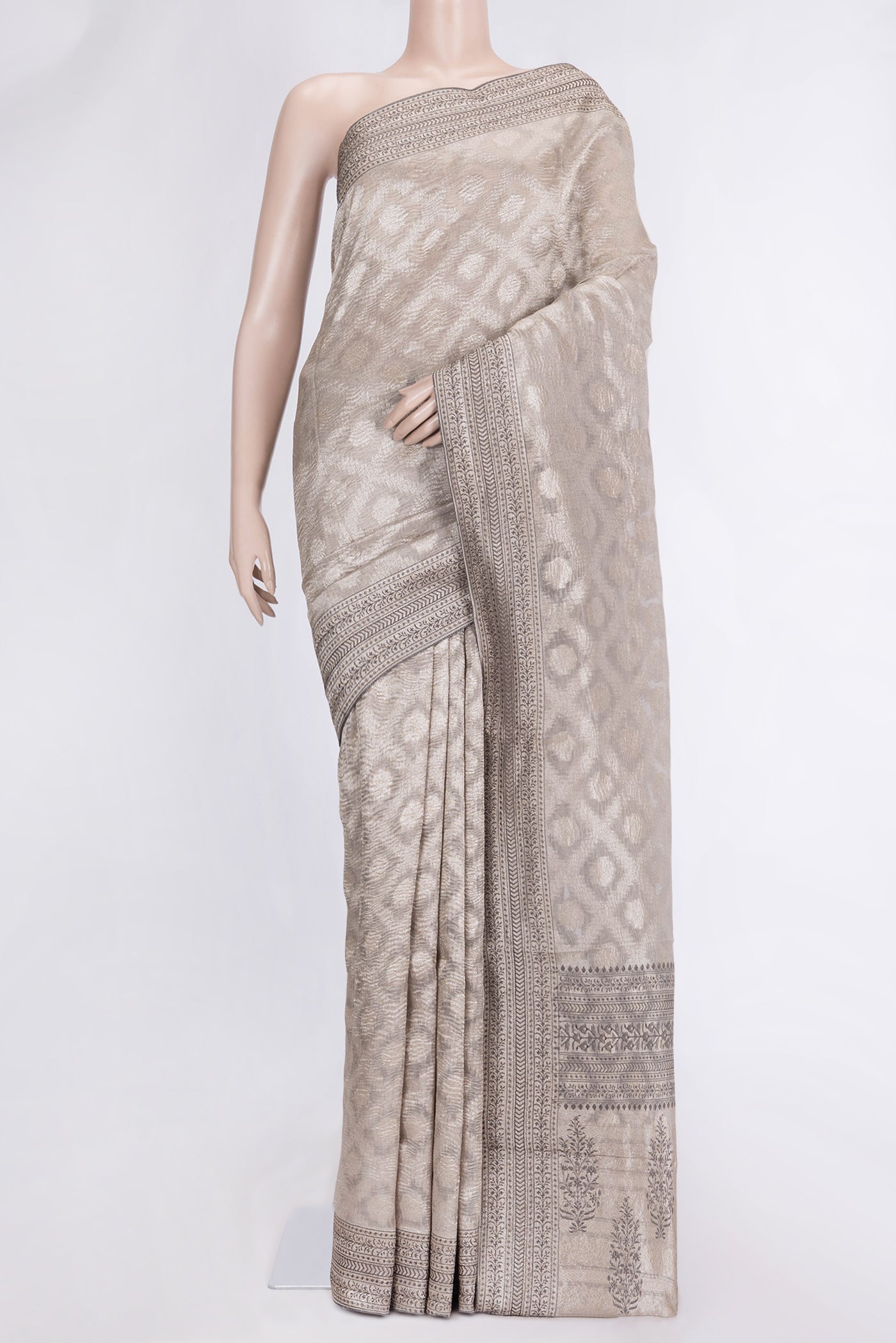Silver Dual Tone Organza Silk Saree with Zari Brocade on the body and Embroidery Border.  displayed on a mannequin