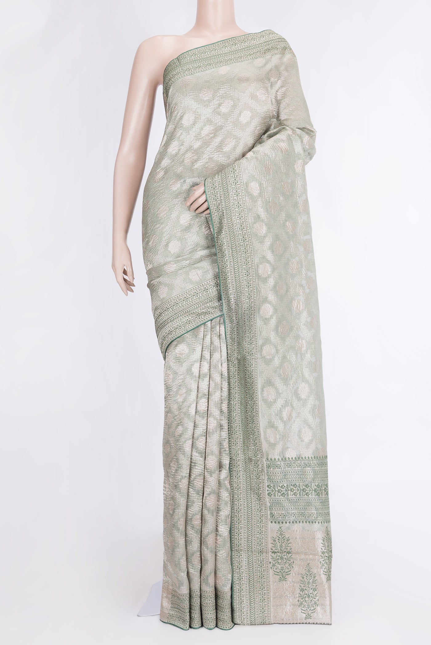 Pista Green Dual Tone Organza Silk Saree with Zari Brocade on the body and Embroidery Border.  displayed on a mannequin