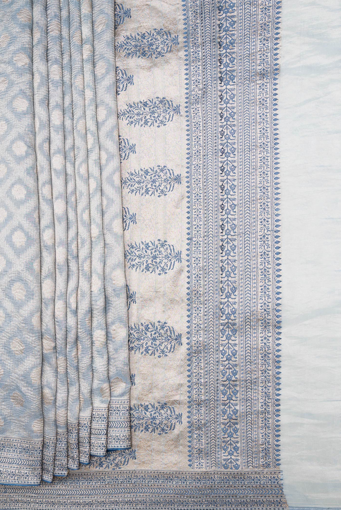 Pleats and pallu of Light Blue Dual Tone Organza Silk Saree with Zari Brocade on the body and Embroidery Border. 