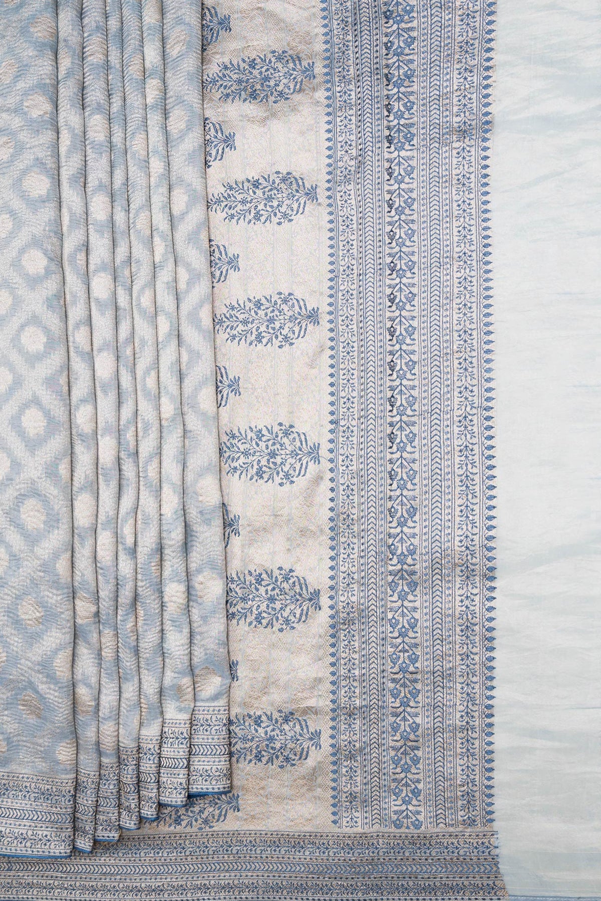 Pleats and pallu of Light Blue Dual Tone Organza Silk Saree with Zari Brocade on the body and Embroidery Border. 