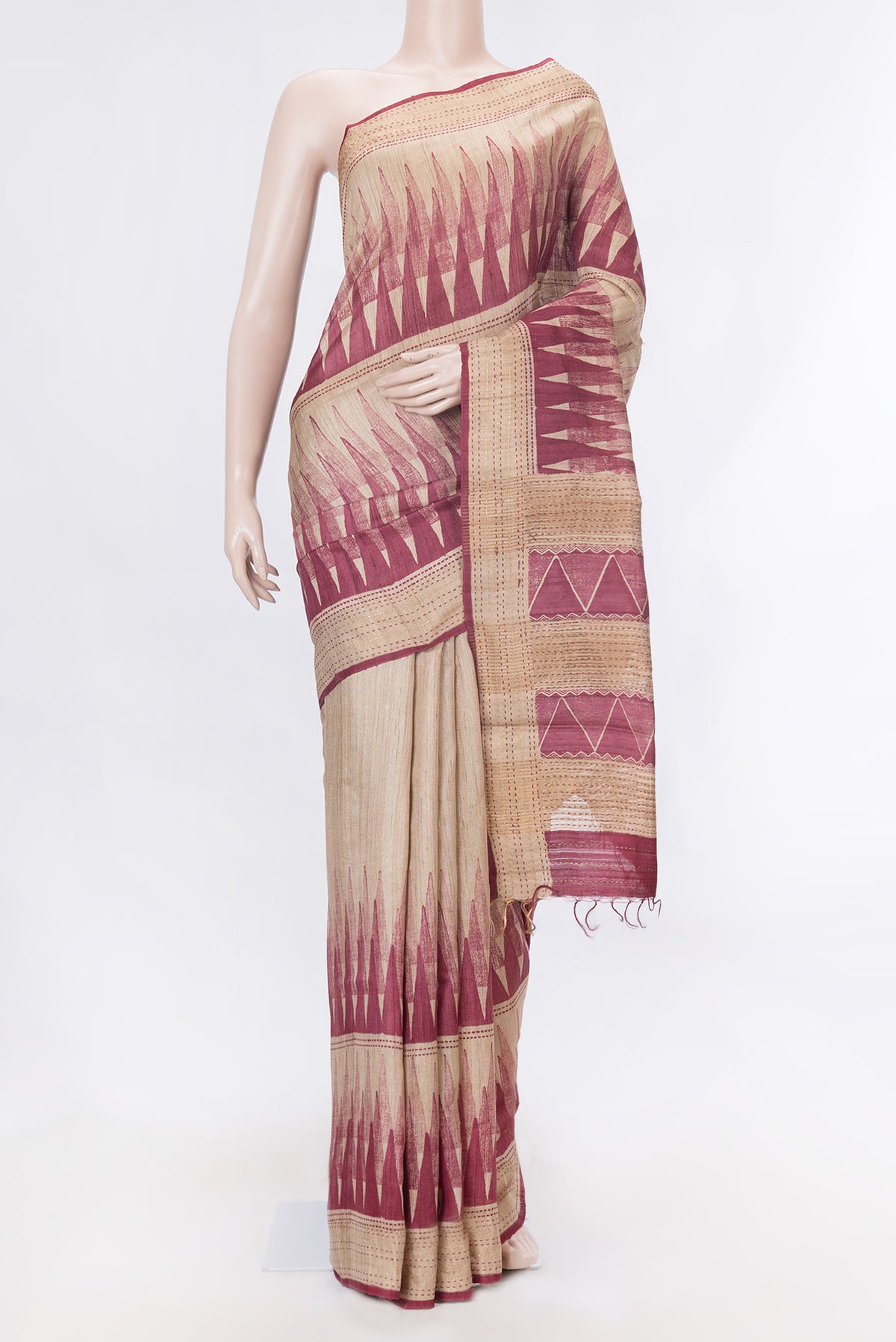 Maroon Dual Tone Tussar Silk Saree With Printed design on the body and Zari Border displayed on a mannequin