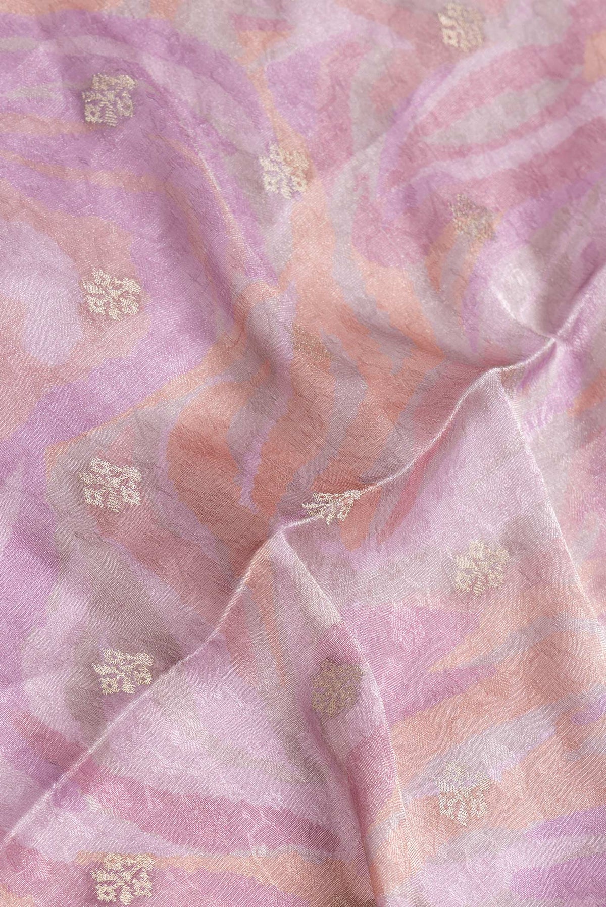 Close up of Lavender Dual Tone Mysore Georgette Saree with Printed design on the body and Fancy Border.  displaying folds
