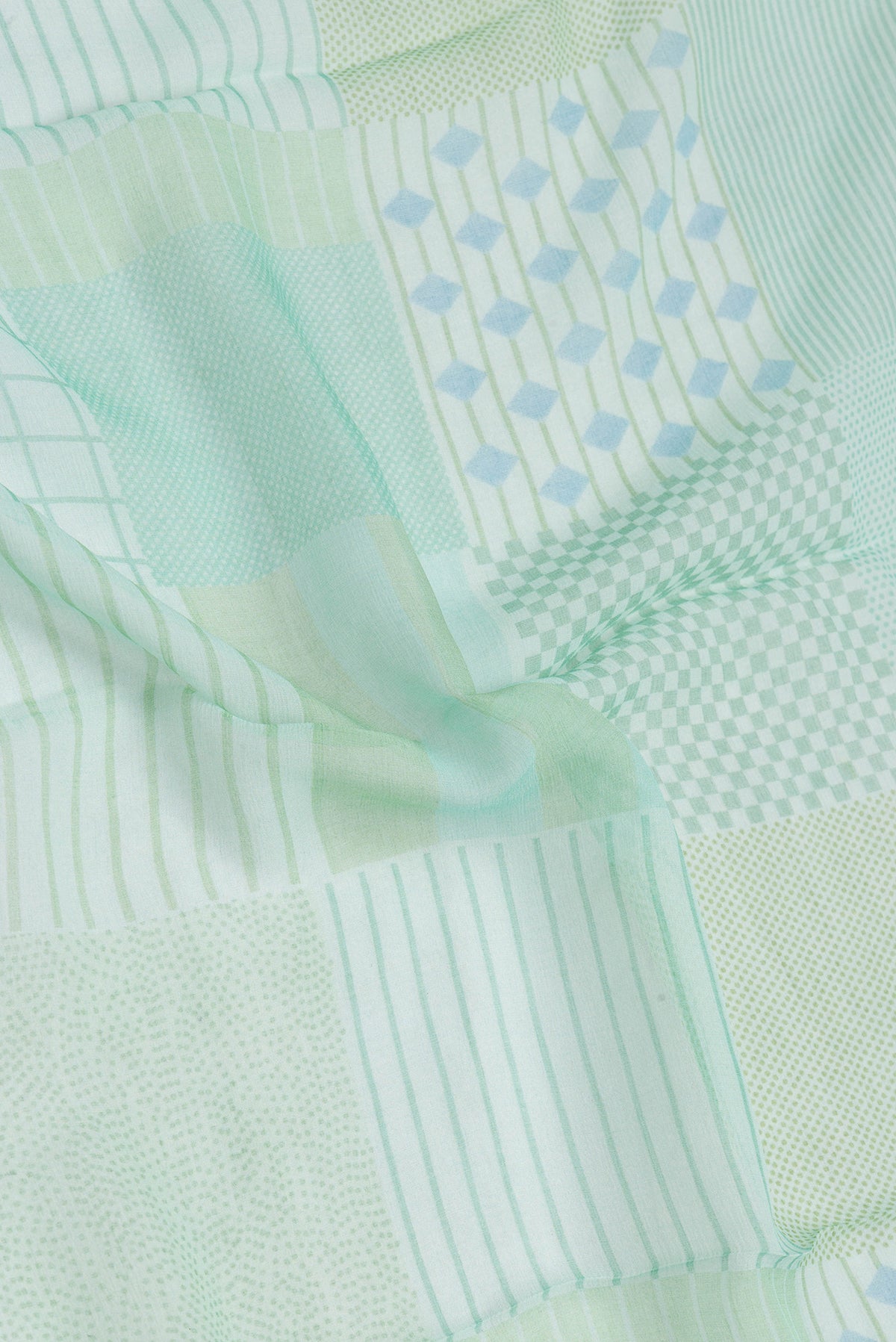 Close up of Sea Green Dual Tone Mysore Chiffon Saree with Printed design on the body and Thread Border.  displaying folds