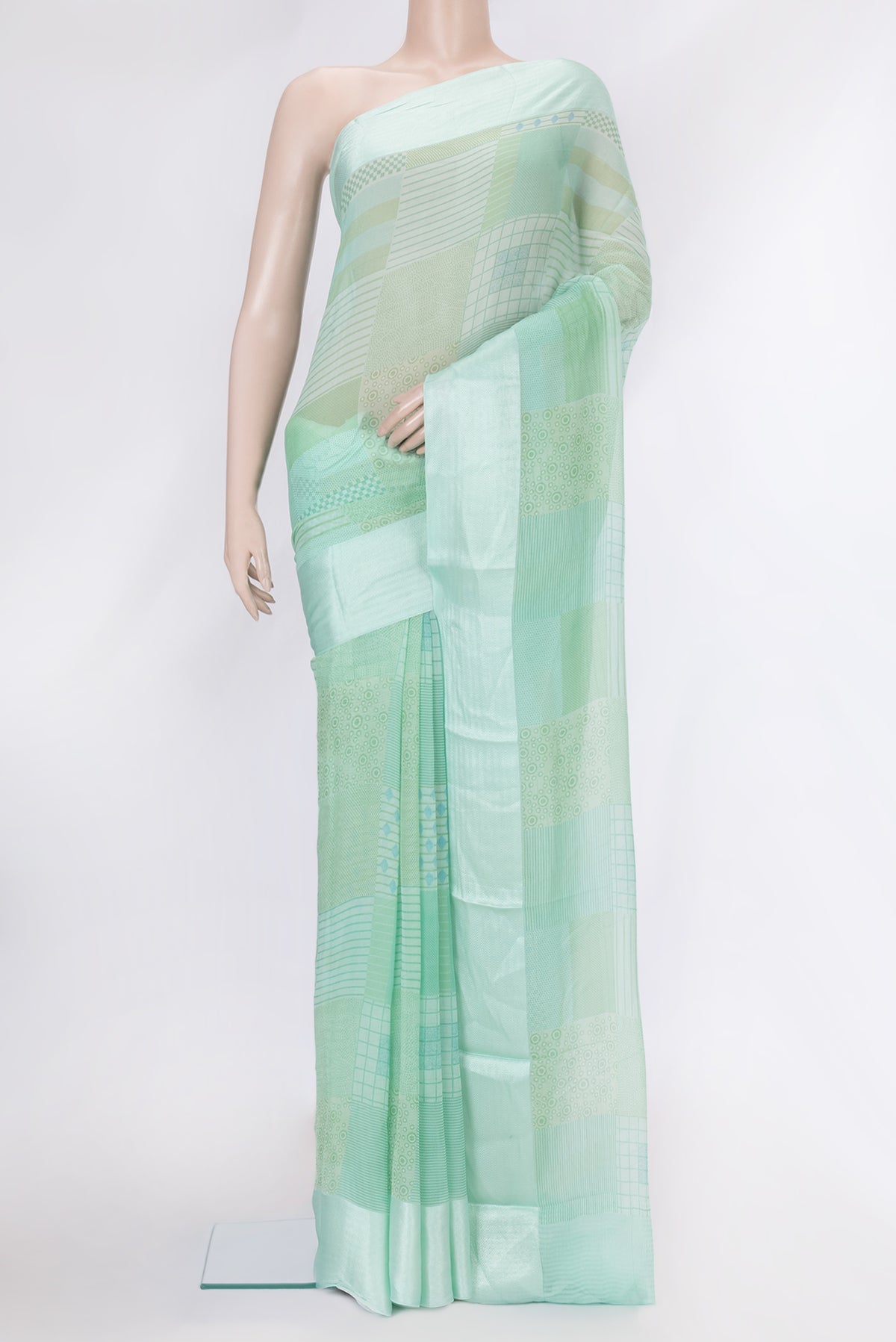 Sea Green Dual Tone Mysore Chiffon Saree with Printed design on the body and Thread Border.  displayed on a mannequin