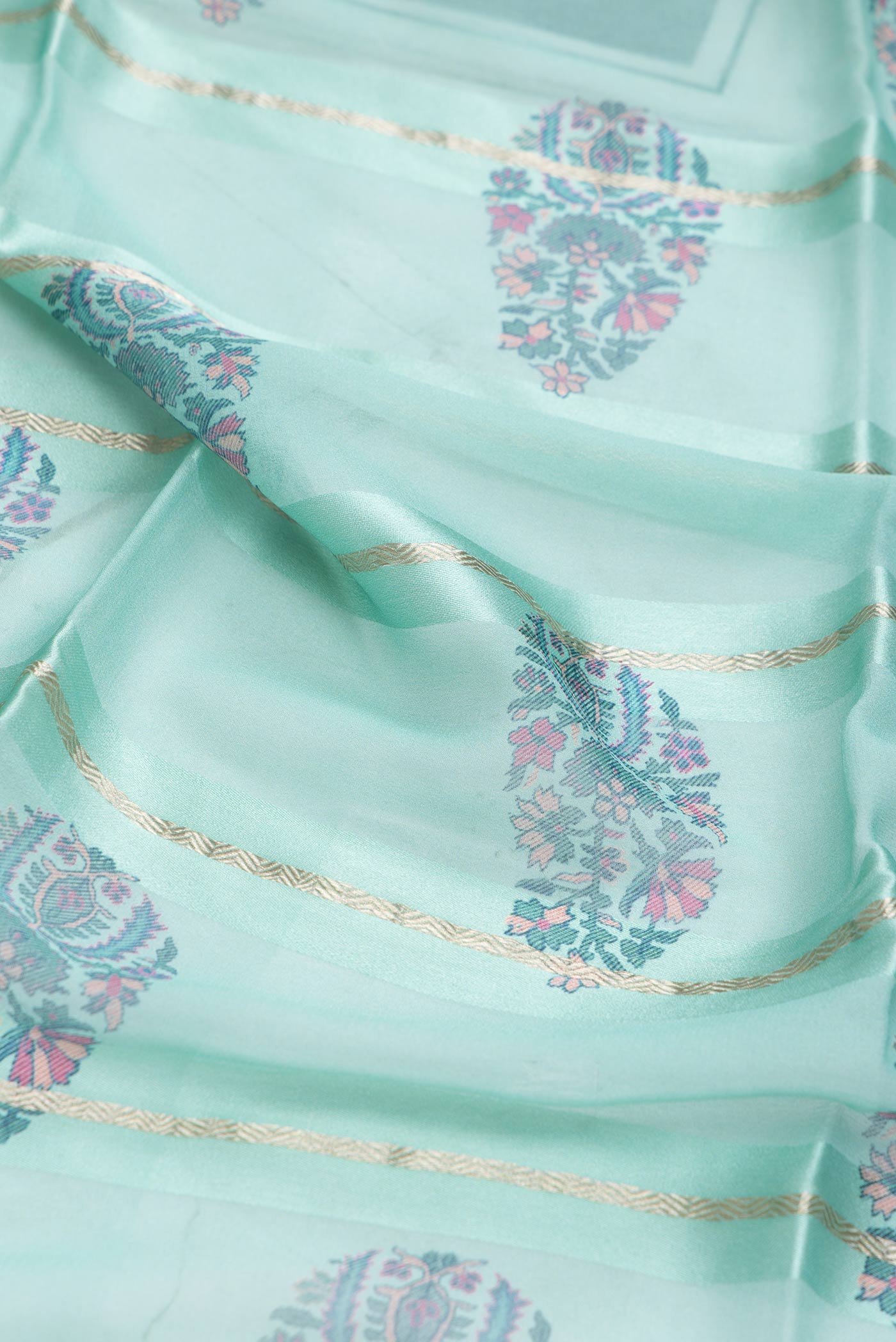 Close up of Sea Green Dual Tone Mysore Georgette SareePrinted design on the body and Zari Border displaying folds