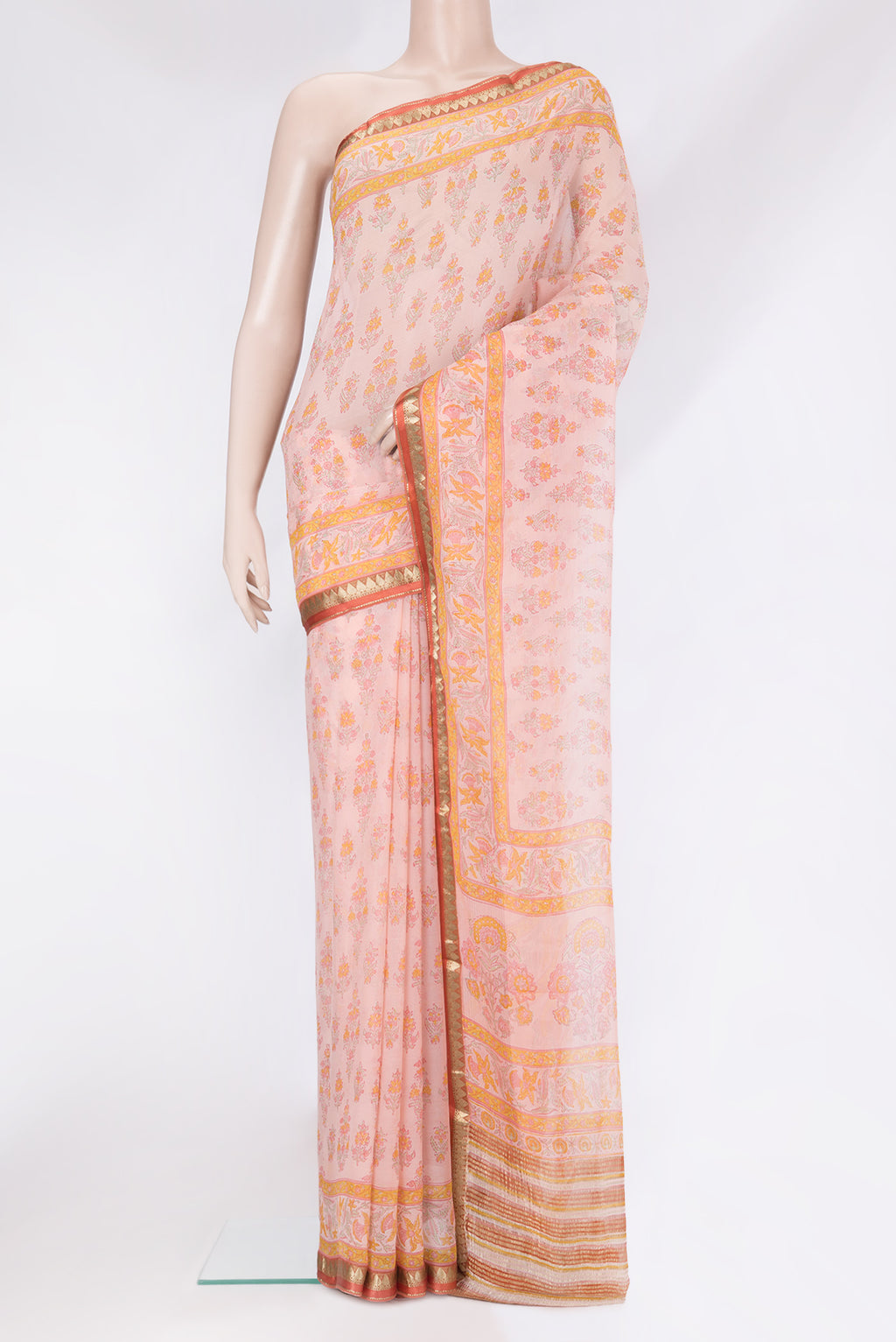 Rose Gold Mysore Chiffon Saree with Printed design on the body and Zari Border.  displayed on a mannequin