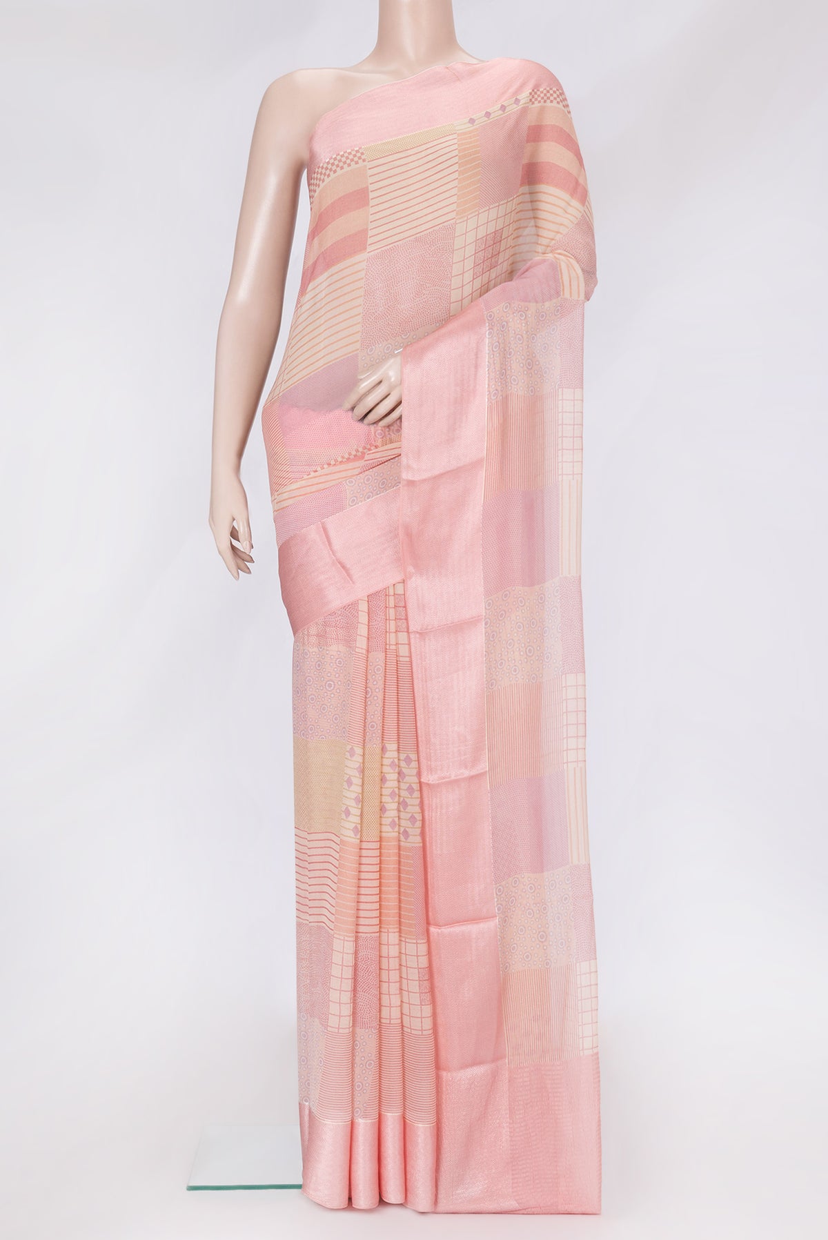 Golden Peach Dual Tone Mysore Chiffon Saree with Printed design on the body and Thread Border.  displayed on a mannequin