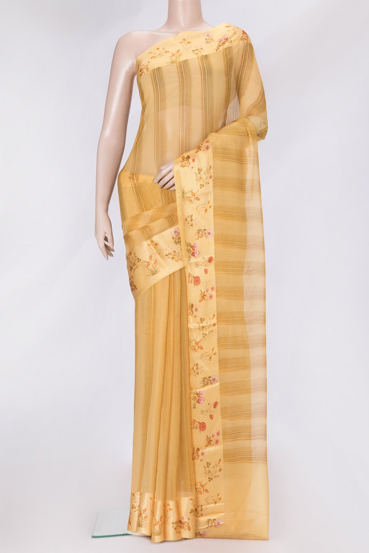 Sandal Dual Tone Mysore Chiffon Saree with Printed design on the body and Thread Border.  displayed on a mannequin