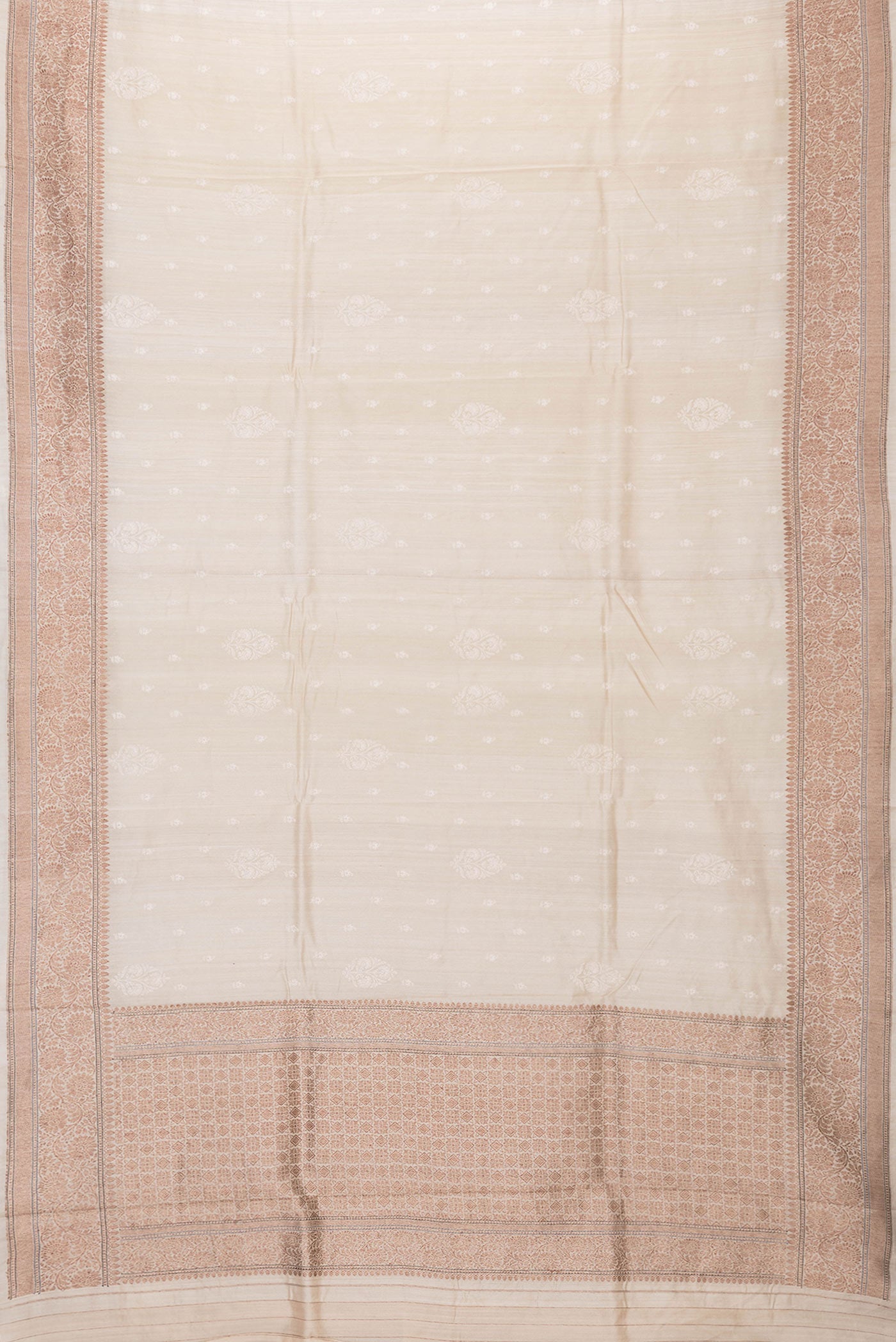 Flat view of Beige Dual Tone Tussar Silk Saree with Embroidery on the body and Zari Border. 