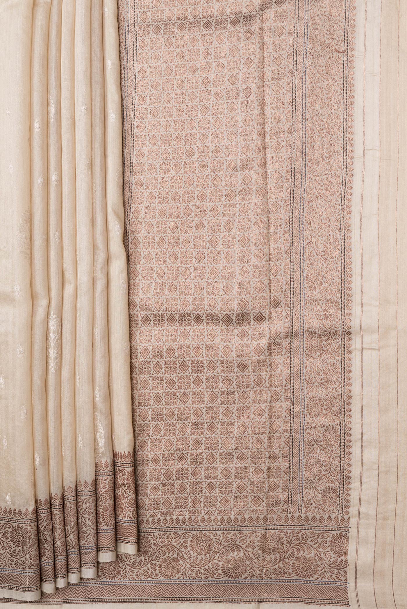 Pleats and pallu of Beige Dual Tone Tussar Silk Saree with Embroidery on the body and Zari Border. 