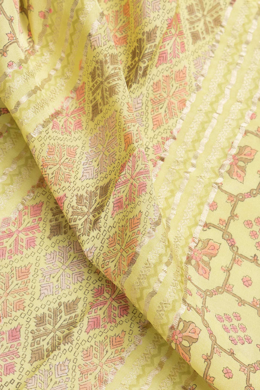 Close up of Lemon Yellow Dual Tone Mysore Crepe Saree with Printed design on the body and Zari Border.  displaying folds