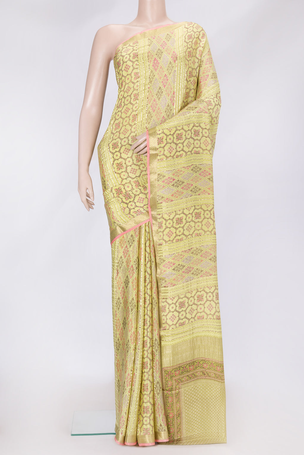 Lemon Yellow Dual Tone Mysore Crepe Saree with Printed design on the body and Zari Border.  displayed on a mannequin