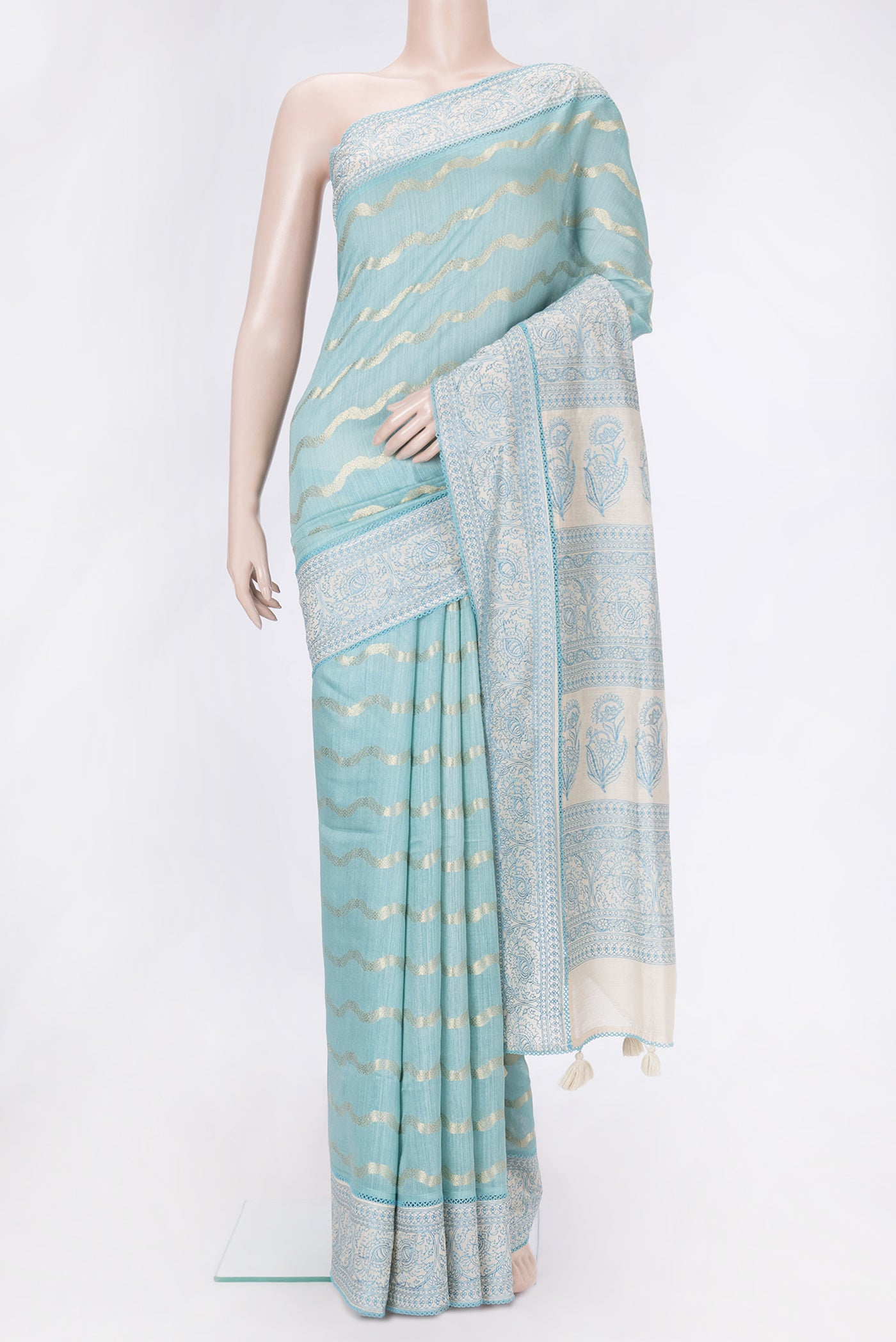 Sky Blue Dual Tone Tussar Silk Saree with Stripes on the body and Embroidery Border.  displayed on a mannequin
