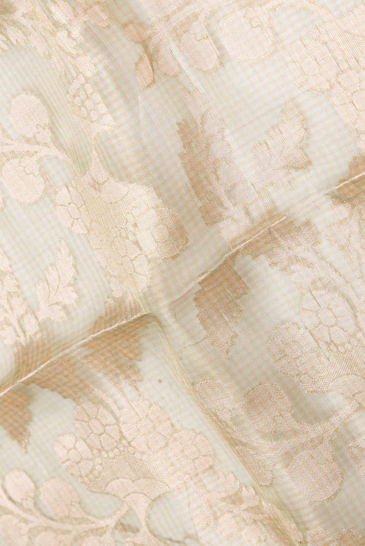 Close up of Mehandi Green Dual Tone Organza Silk Saree with Zari Brocade on the body and Zari Border displaying folds